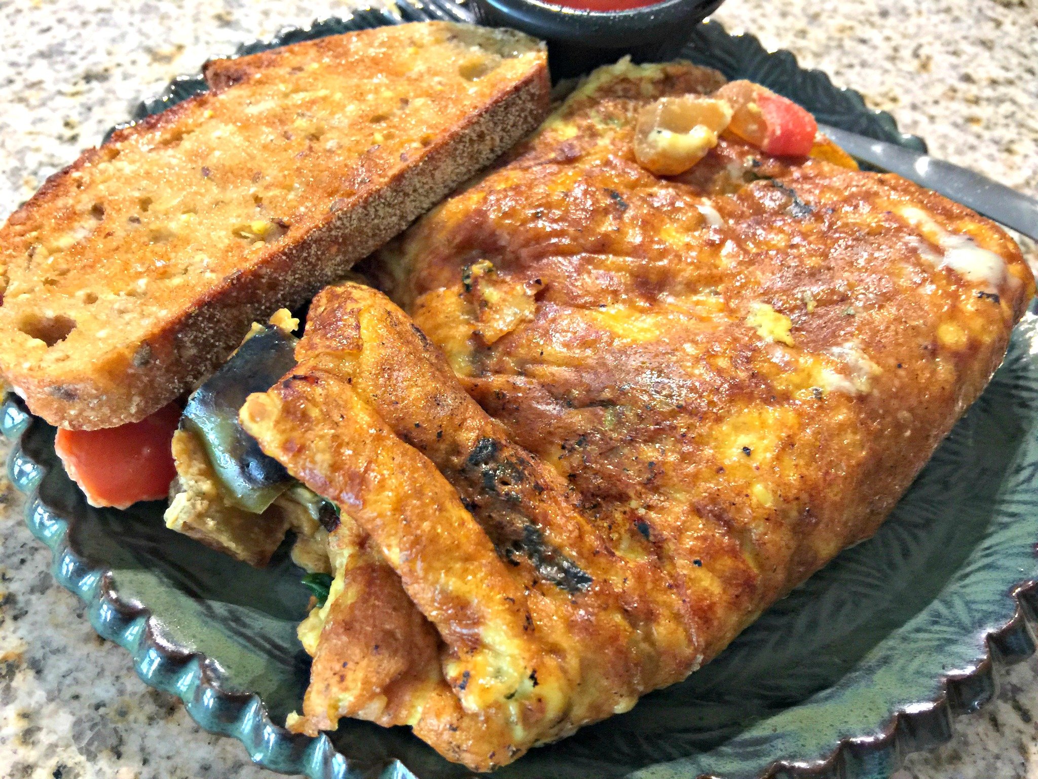 Vegetable Omelet: Sautéed Onions, Tomatoes, Spinach, Bell Peppers with Pepperjack Cheese. 