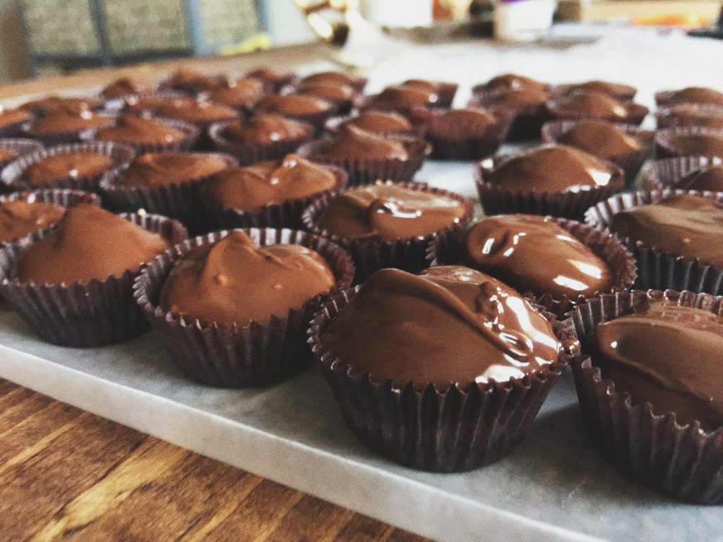 Homemade Protein Packed Peanut Butter Cups Made With 60 % Dark Chocolate + Flaxseeds, Chia Seeds, Coconut Oil & Honey!