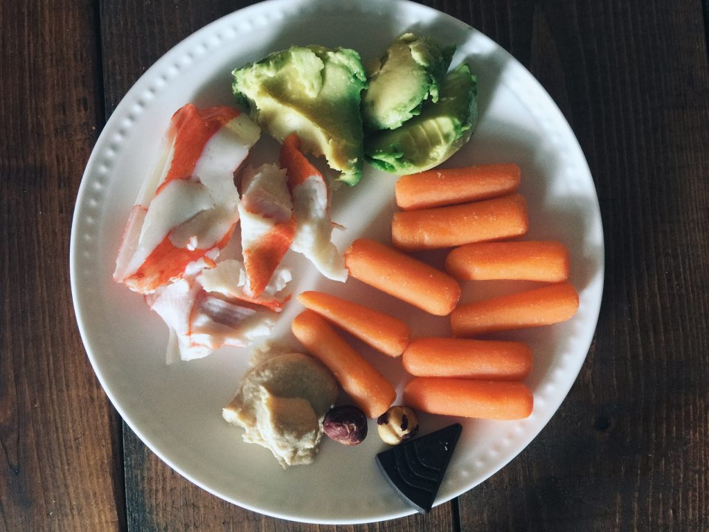 lunch: carrots, crab, hummus, avocado, hazelnuts and chocolate 