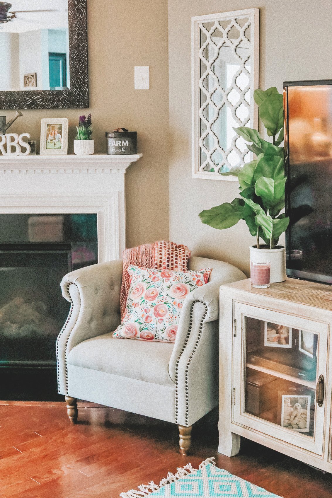 living room decor, home decor, simply taralynn, colorful, southern chic, creamy colorful living room, home decor, remodel, colorful living room, cozy, pillows, chairs, entertainment center decor, plants, floral, vintage, home design, interior, decorations, summer feel