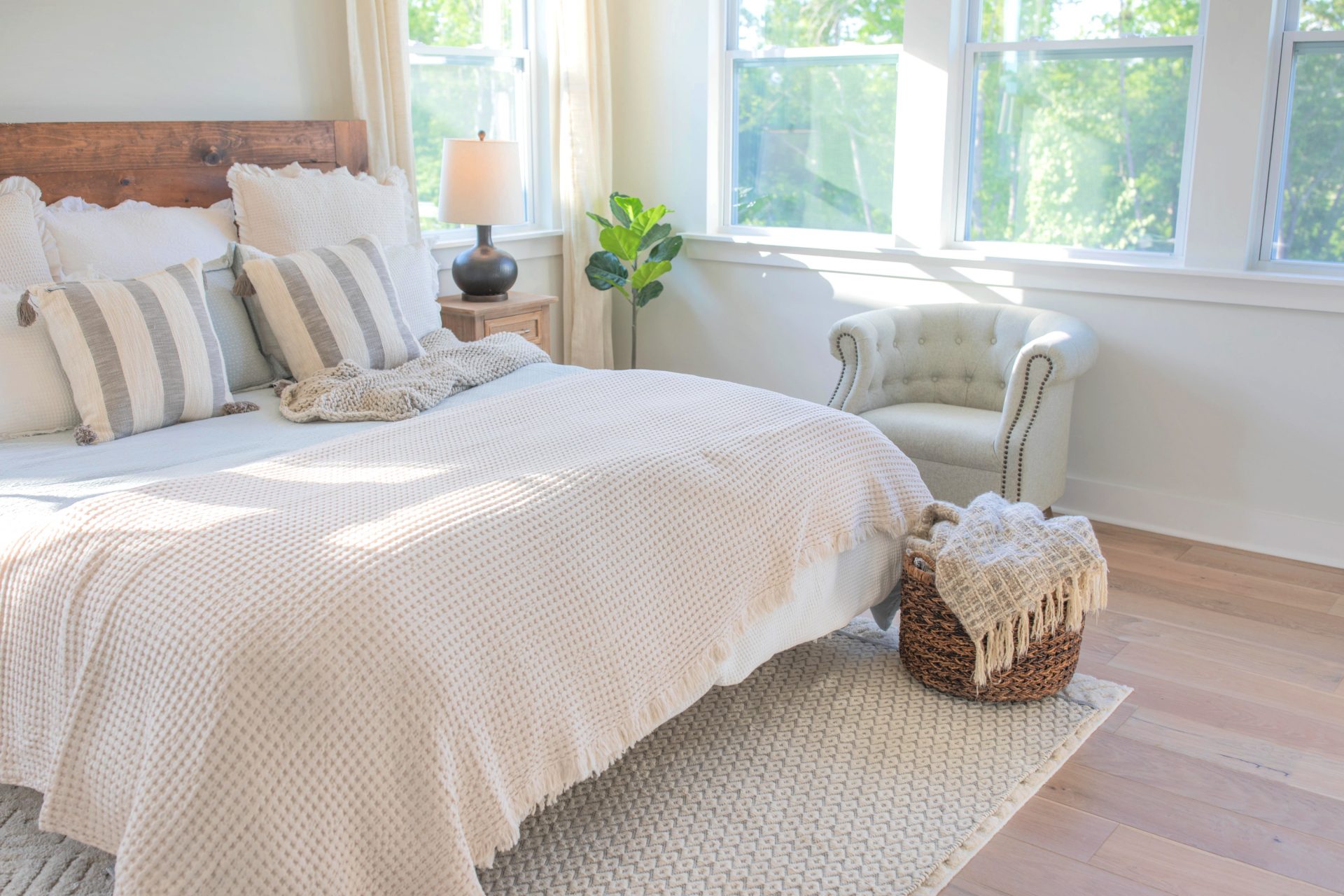 creamy bedroom, master bedroom, cottage, drapes, bedding, cozy bedroom, quilt, ivory bed, ivory quilt bedroom, master bedroom decor, neutral colors, target, HomeGoods, hobby lobby, bedding, hardwood floors, end tables, black curtain rods, linen drapes