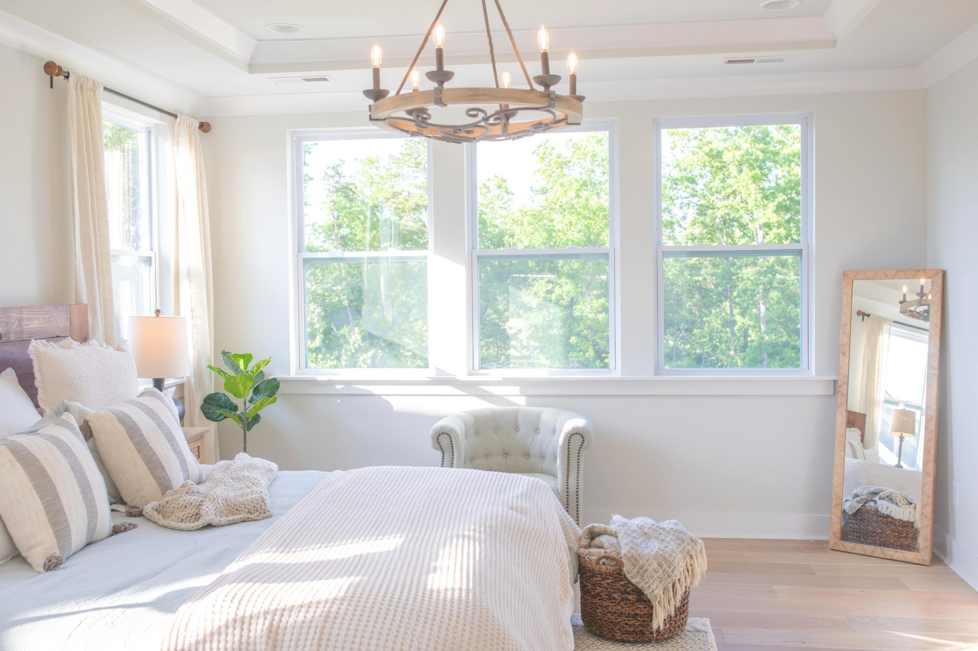 creamy bedroom, master bedroom, cottage, drapes, bedding, cozy bedroom, quilt, ivory bed, ivory quilt bedroom, master bedroom decor, neutral colors, target, HomeGoods, hobby lobby, bedding, hardwood floors, end tables, black curtain rods, linen drapes
