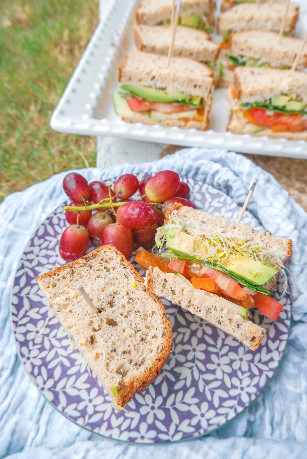 gluten free, plant based, sandwich, dairy free, lunch, vegetable sandwich, picnic, veggie sandwich, grapes, avocado, collard greens, hummus, veganaise, tomatoes, lunch idea, vegan, avocado, sprouts, cucumber, food, healthy eating, eat clean, veggie