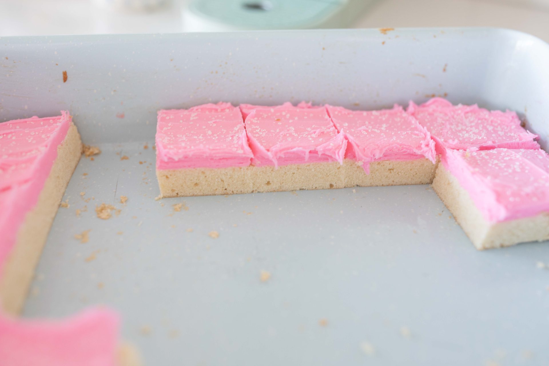 frosted sugar cookie bars, sugar cookies, pink frosting, pink frosted sugar cookies, almond sugar cookies, almond extract, holiday, baking, pretty food, pink valentines day bars, spring sugar cookie bars, delicious recipe, the best sugar cookie bars, how to make sugar cookie bars, dessert, valentines day treats, easter, spring, pretty food, simply taralynn recipes, baking