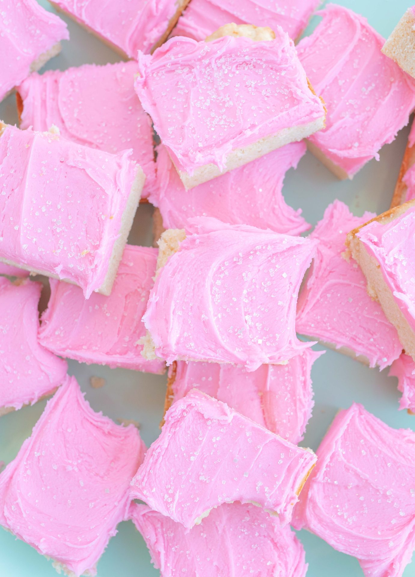 frosted sugar cookie bars, sugar cookies, pink frosting, pink frosted sugar cookies, almond sugar cookies, almond extract, holiday, baking, pretty food, pink valentines day bars, spring sugar cookie bars, delicious recipe, the best sugar cookie bars, how to make sugar cookie bars, dessert, valentines day treats, easter, spring, pretty food, simply taralynn recipes, baking