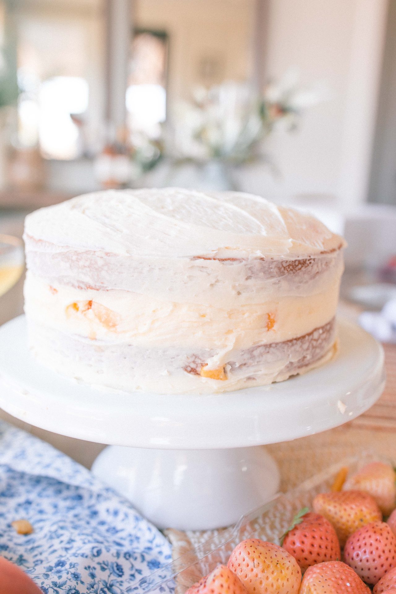 cake, almond cake, wedding cake, pineberries, pineberry recipe, what to make with pineberries, strawberries, peach cake, almond wedding cake, almond buttercream, easy cake recipe, amazing cake, dessert, spring cake, fruit cake, layered almond buttercream cake, the best cake flavors, how to make a layered cake