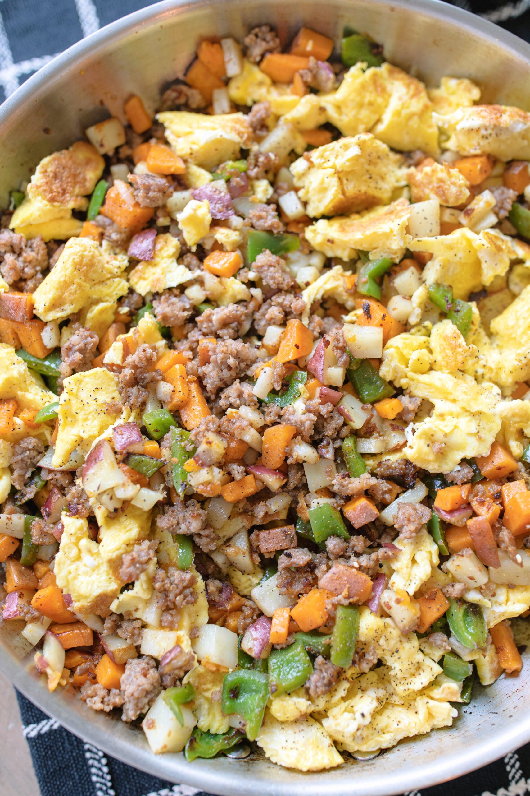 breakfast hash, healthy breakfast recipe, Fodmap approved recipe, low fodmap recipe, inflamation diet recipe, paleo breakfast, whole30 breakfast, healthy breakfast ideas, savory breakfast, maple hash, sausage hash egg breakfast, eggs, egg recipes, high protein breakfast, gluten-free, gluten-free recipes, dairy-free recipes, gluten free breakfast, dairy free breakfast, sweet potato hash, best recipes for breakfast, easy breakfast ideas, meal prep idea for breakfast, high protein breakfast