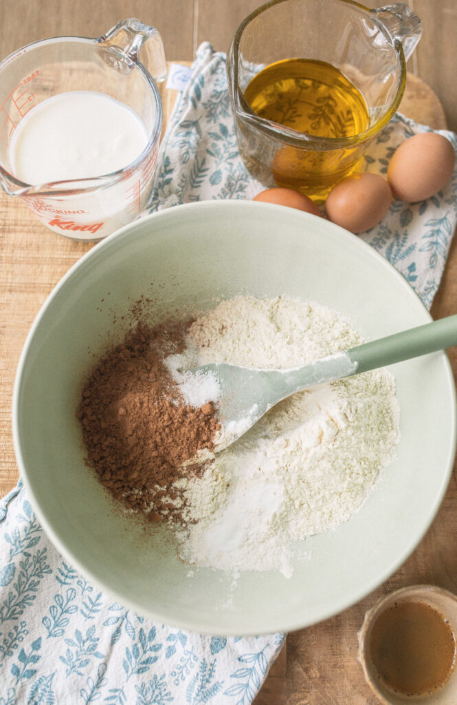 Chocolate olive oil cake, olive oil chocolate cake, moist chocolate cake recipe, chocolate cake with vanilla buttercream, best chocolate cake recipe, dairy-free chocolate cake, gluten-free chocolate cake, italian cake, italian olive oil cake, easy chocolate cake recipe, homemade chocolate cake, rich and moist chocolate cake, how to make chocolate olive oil cake, the best chocolate cake with vanilla buttercream, easy recipe, why use olive oil in chocolate cake, moist chocolate cake with vanilla frosting, olive oil vs. butter in chocolate cake, pretty desserts, buttermilk chocolate cake, fancy chocolate cake recipe.