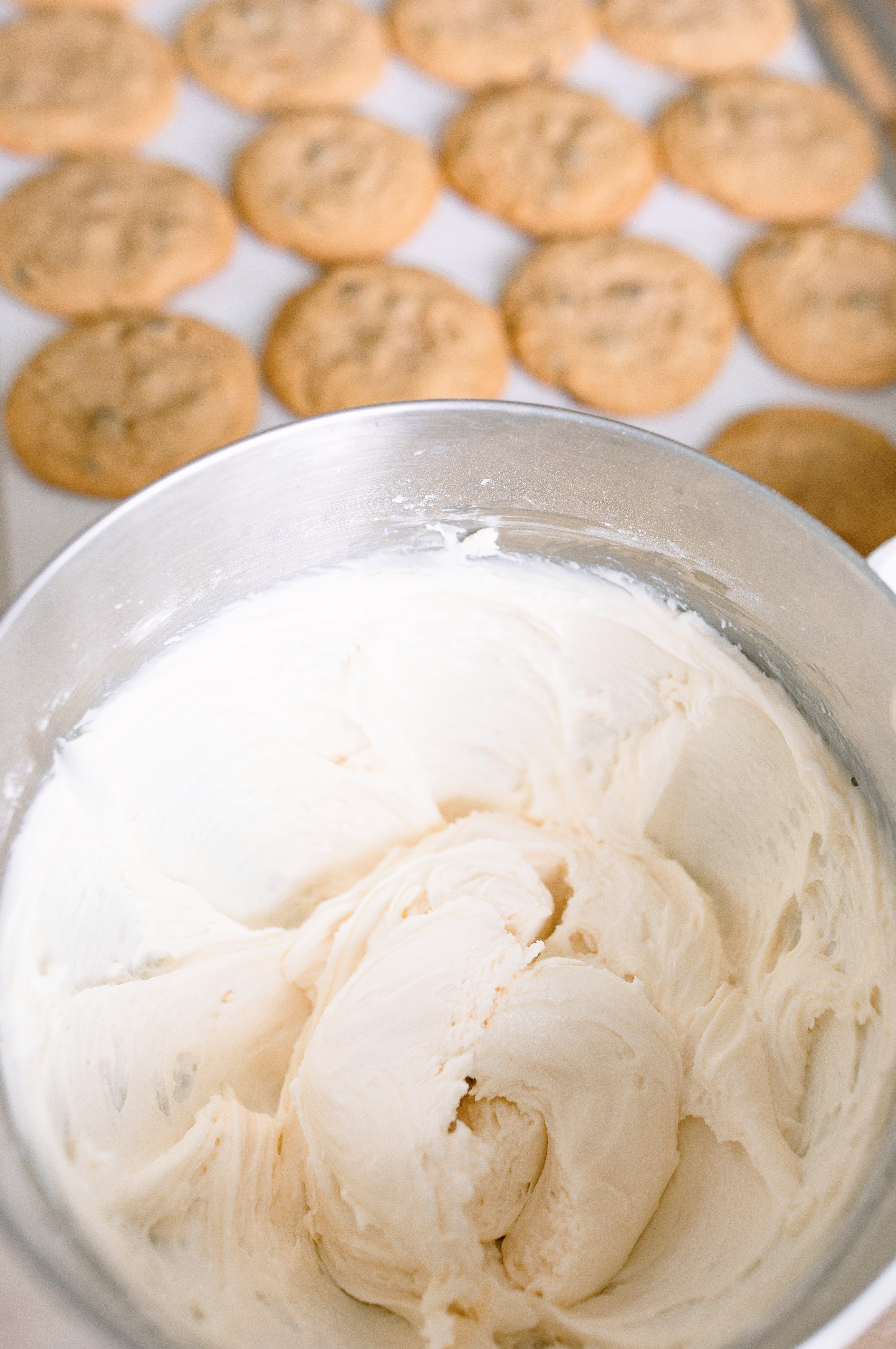 frosted cookies, snickers, dessert, candy bar, homemade salted caramel buttercream, buttercream frosting, peanut butter snickers cookies, peanut butter cookies, amazing dessert ever, the best frosted cookie recipe, salted caramel buttercream, peanut butter cookies, baking, soft, thick cookies, bakery, recipe