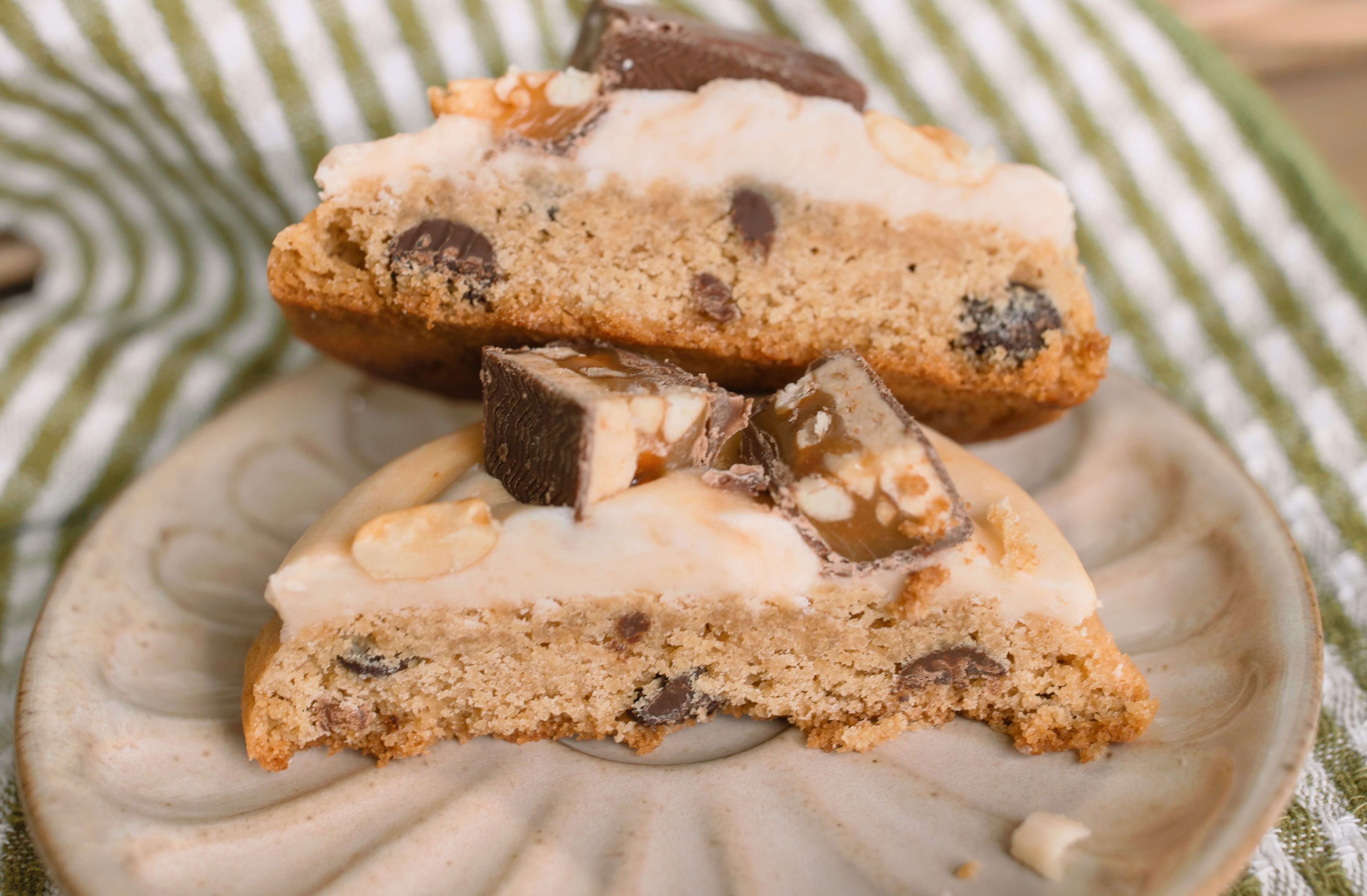 frosted cookies, snickers, dessert, candy bar, homemade salted caramel buttercream, buttercream frosting, peanut butter snickers cookies, peanut butter cookies, amazing dessert ever, the best frosted cookie recipe, salted caramel buttercream, peanut butter cookies, baking, soft, thick cookies, bakery, recipe