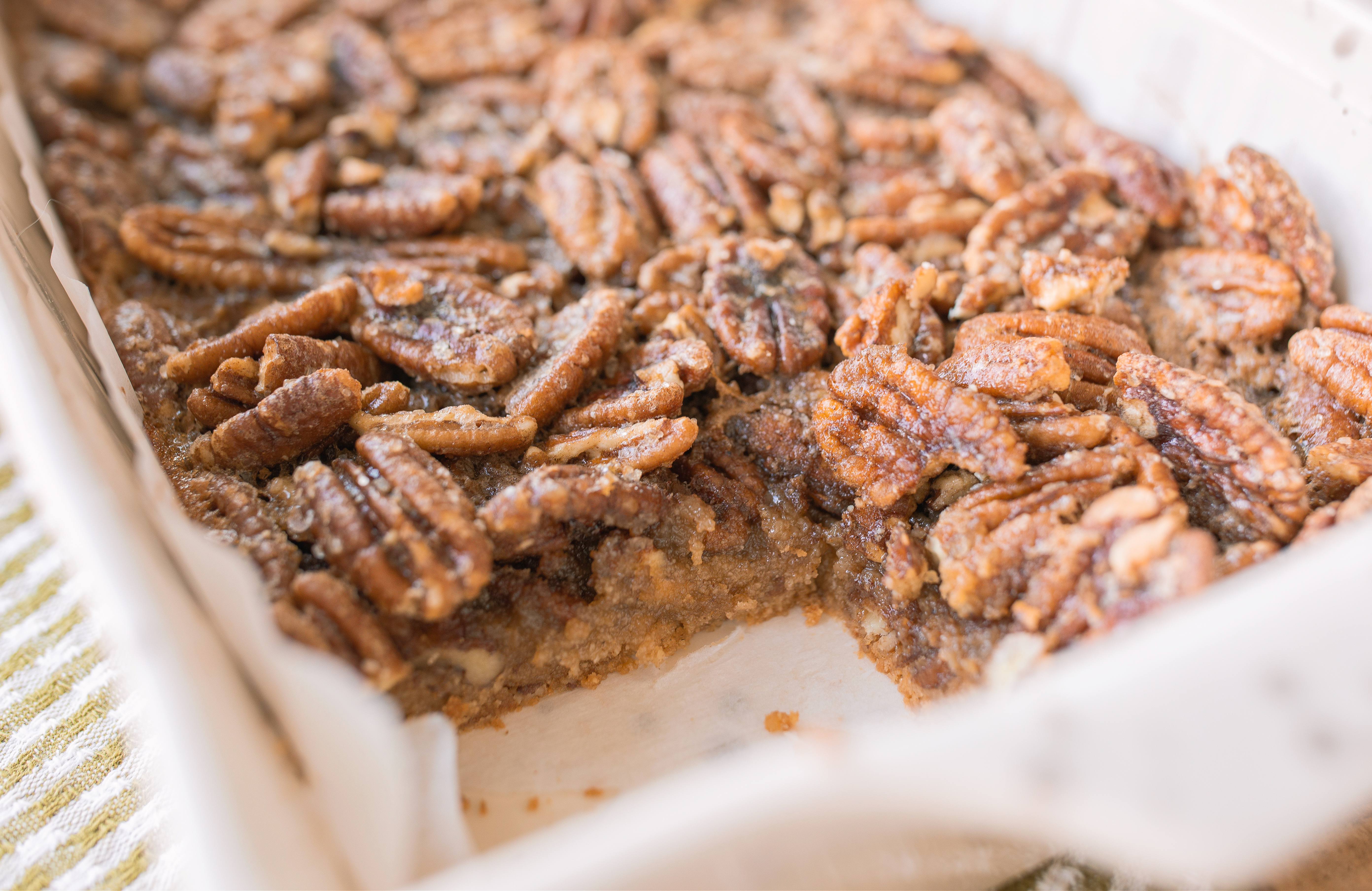 pecan bars, gluten free pecan bars, almond flour pecan bars, healthy pecan bars, refined sugar free pecan bars, maple pecan bars, coconut sugar pecan bars, paleo pecan bars, easy pecan bar recipe, thanksgiving pecan bars, thanksgiving dessert recipes, fall dessert recipes, healthy holiday desserts, gluten free thanksgiving desserts, no refined sugar desserts, maple syrup desserts, almond flour dessert recipes, coconut sugar desserts, easy holiday baking, healthy pecan pie bars