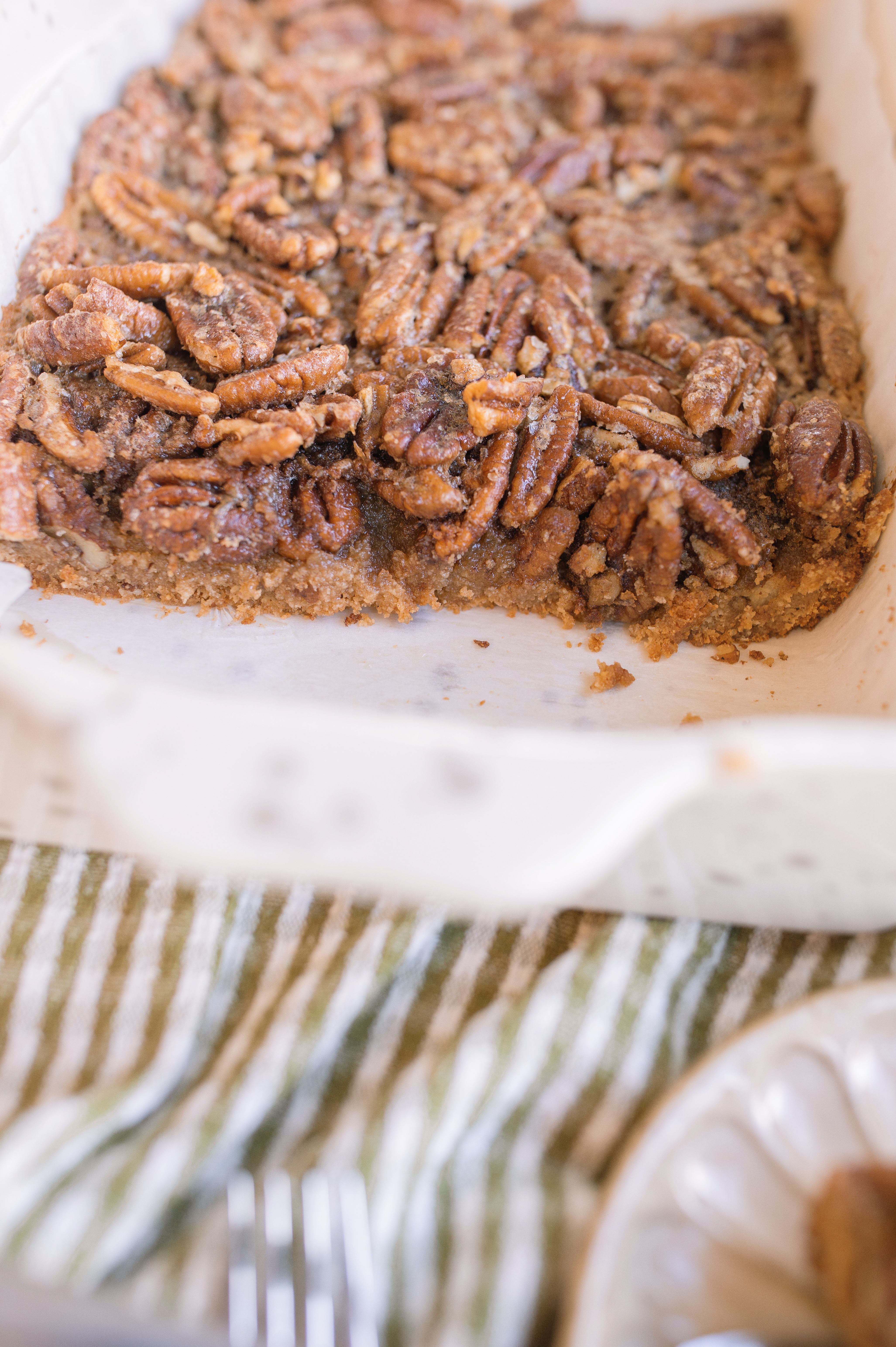 pecan bars, gluten free pecan bars, almond flour pecan bars, healthy pecan bars, refined sugar free pecan bars, maple pecan bars, coconut sugar pecan bars, paleo pecan bars, easy pecan bar recipe, thanksgiving pecan bars, thanksgiving dessert recipes, fall dessert recipes, healthy holiday desserts, gluten free thanksgiving desserts, no refined sugar desserts, maple syrup desserts, almond flour dessert recipes, coconut sugar desserts, easy holiday baking, healthy pecan pie bars