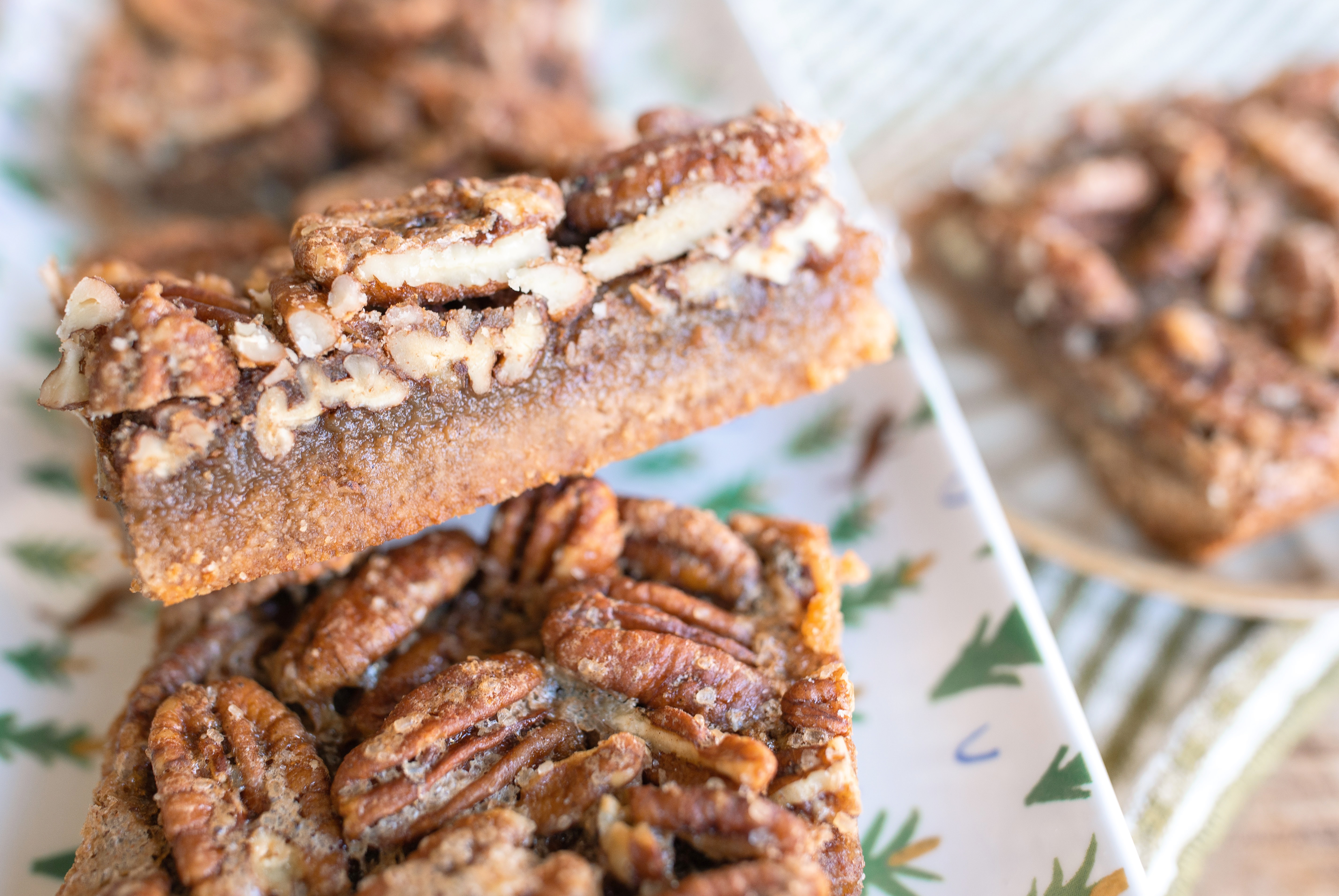 pecan bars, gluten free pecan bars, almond flour pecan bars, healthy pecan bars, refined sugar free pecan bars, maple pecan bars, coconut sugar pecan bars, paleo pecan bars, easy pecan bar recipe, thanksgiving pecan bars, thanksgiving dessert recipes, fall dessert recipes, healthy holiday desserts, gluten free thanksgiving desserts, no refined sugar desserts, maple syrup desserts, almond flour dessert recipes, coconut sugar desserts, easy holiday baking, healthy pecan pie bars