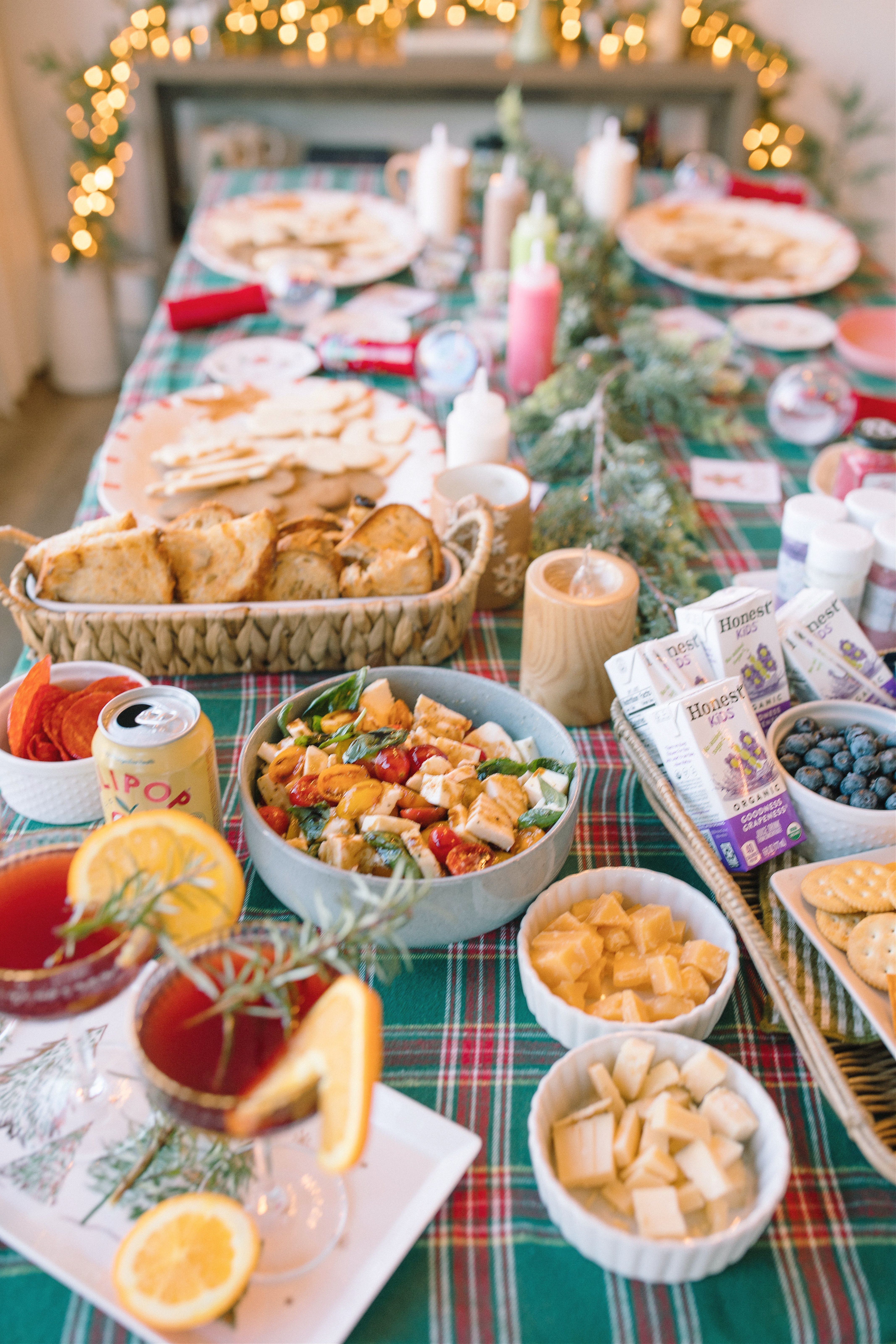 sugar cookie decorating party, cookie decorating with toddlers, mocktails for moms, cherry orange mocktail, cranberry, cookies, dye free, sprinkles, kids fun, pajama party, christmas decor, christmas party, kids charcuterie board