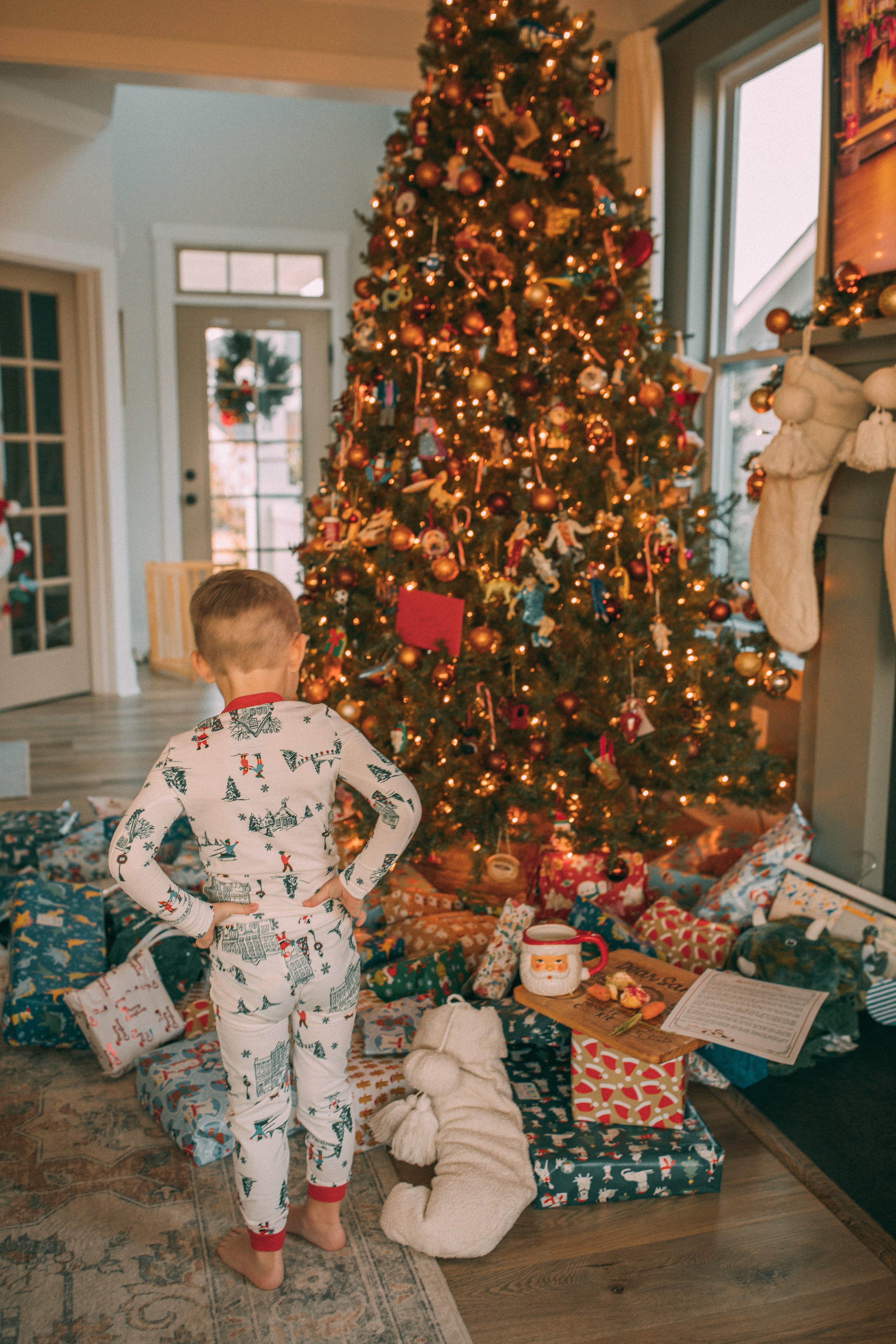 christmas recap, christmas morning, christmas blog, christmas decor, stockings, presents, toddler, dinner, table setting, home, lifestyle, blogging, motherhood, matching family pajamas, menu, holiday dinner, holiday celebrations, christmas day, pecan brownie pie, lottery pong, toddler gifts, cozy fireplace, cookies for santa, recap