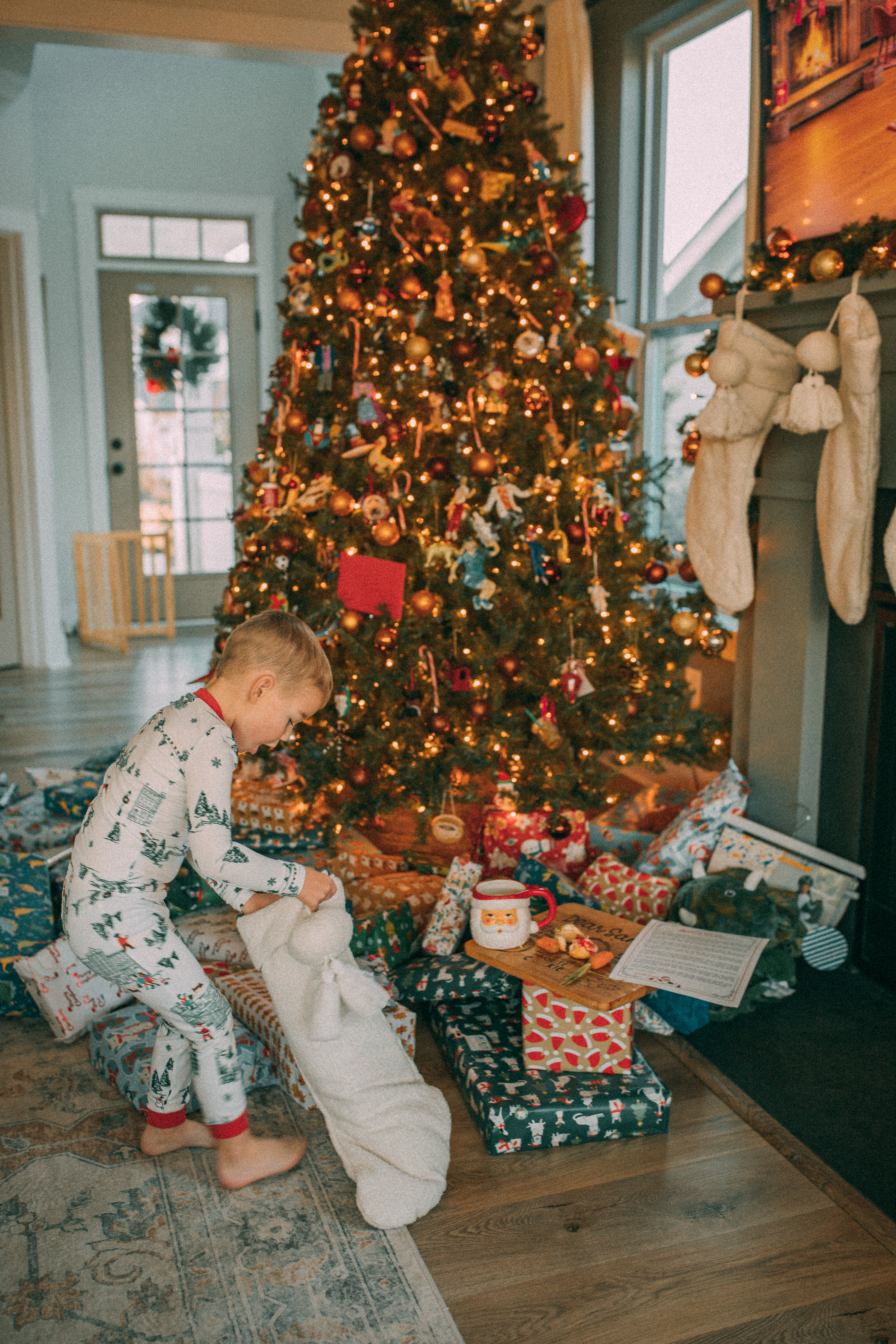 christmas recap, christmas morning, christmas blog, christmas decor, stockings, presents, toddler, dinner, table setting, home, lifestyle, blogging, motherhood, matching family pajamas, menu, holiday dinner, holiday celebrations, christmas day, pecan brownie pie, lottery pong, toddler gifts, cozy fireplace, cookies for santa, recap