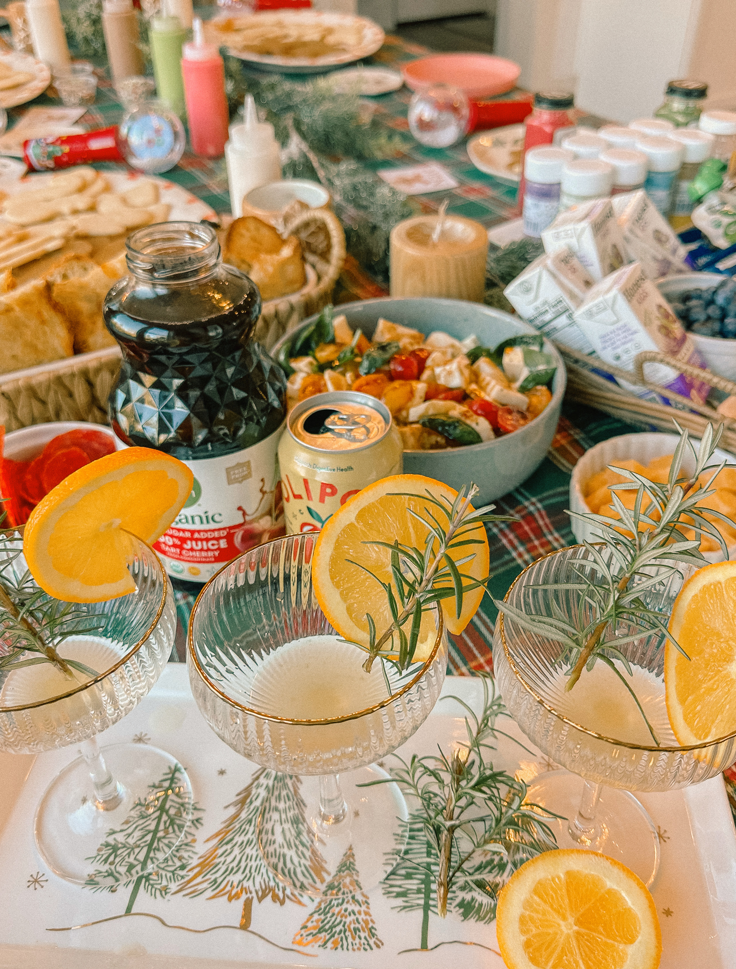 sugar cookie decorating party, cookie decorating with toddlers, mocktails for moms, cherry orange mocktail, cranberry, cookies, dye free, sprinkles, kids fun, pajama party, christmas decor, christmas party, kids charcuterie board