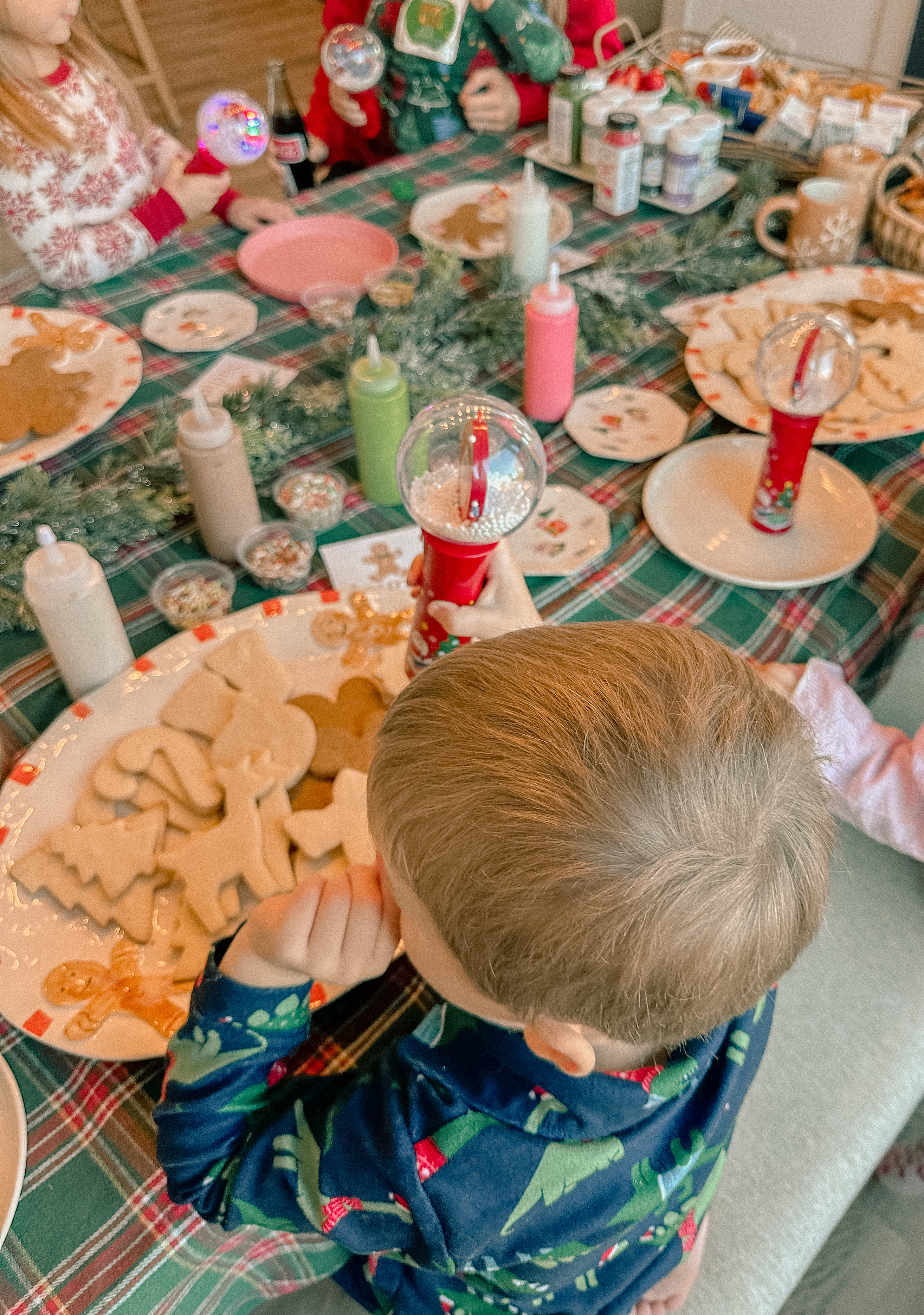 sugar cookie decorating party, cookie decorating with toddlers, mocktails for moms, cherry orange mocktail, cranberry, cookies, dye free, sprinkles, kids fun, pajama party, christmas decor, christmas party, kids charcuterie board