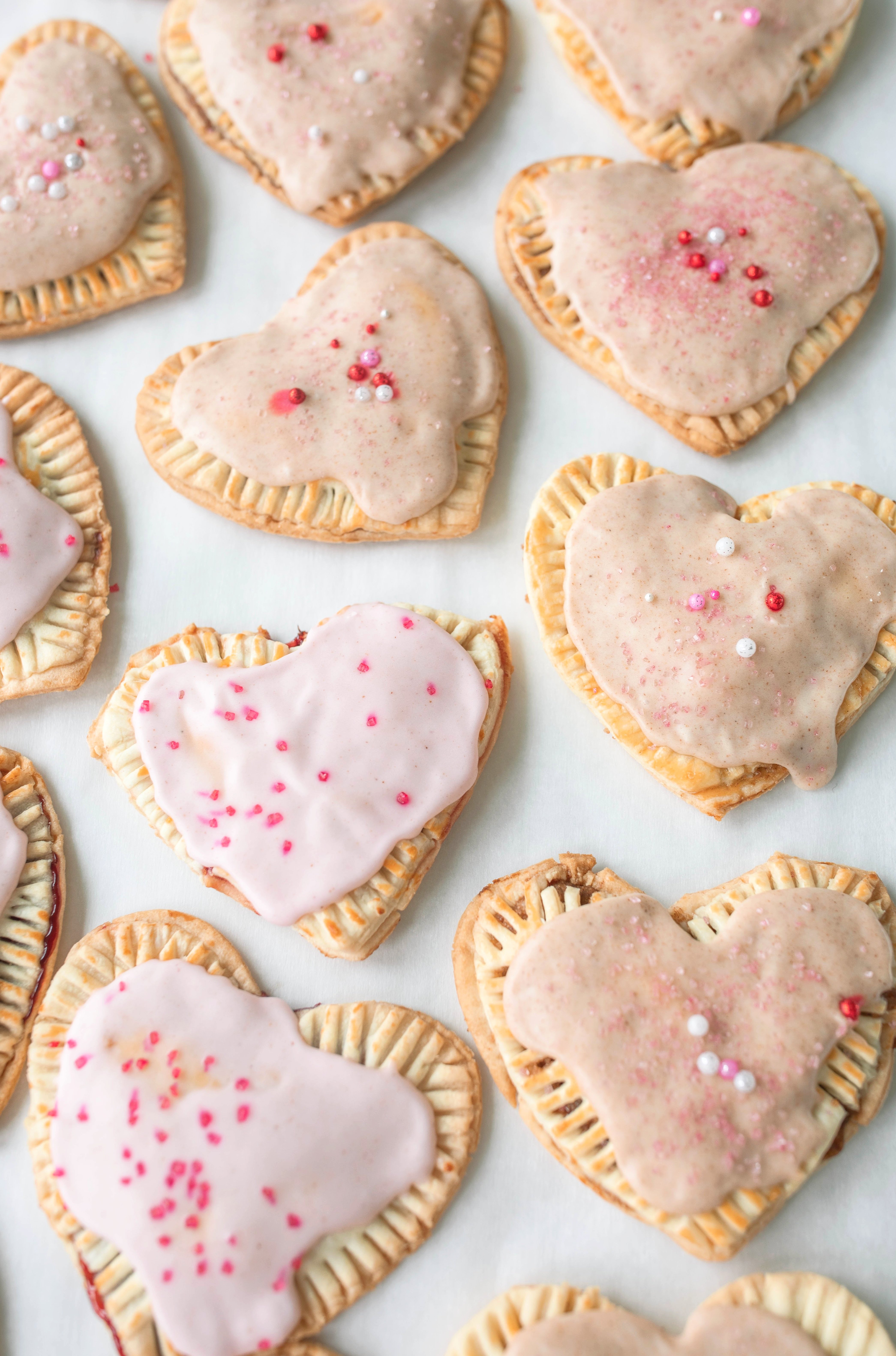 heart poptarts, cherry poptarts, brown sugar poptarts, cute poptart dessert, easy diy poptarts, valentines day, pastries, cherry almond poptarts, cute gift ideas, bakery box, recipe, easy dessert, frosted poptarts