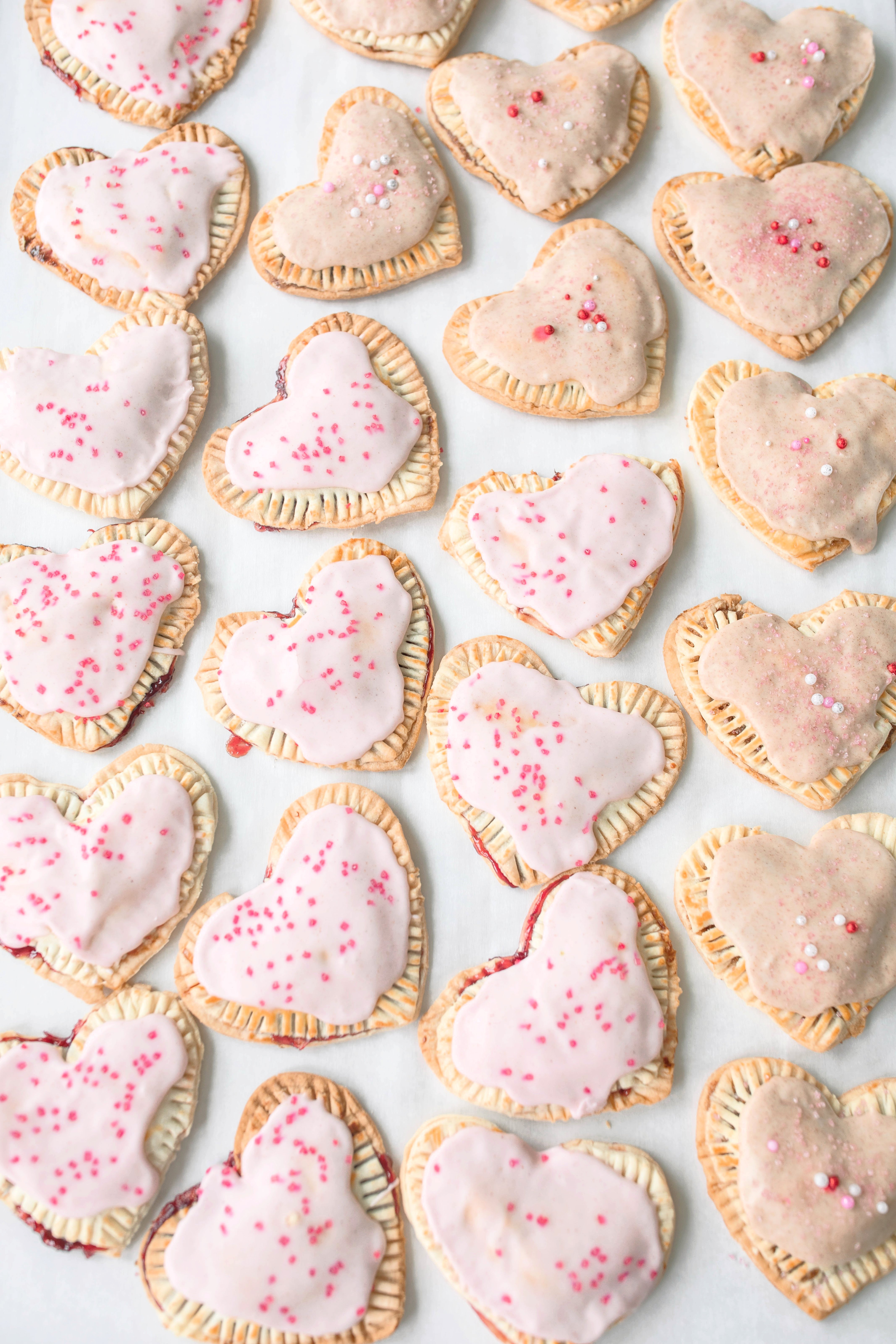 heart poptarts, cherry poptarts, brown sugar poptarts, cute poptart dessert, easy diy poptarts, valentines day, pastries, cherry almond poptarts, cute gift ideas, bakery box, recipe, easy dessert, frosted poptarts