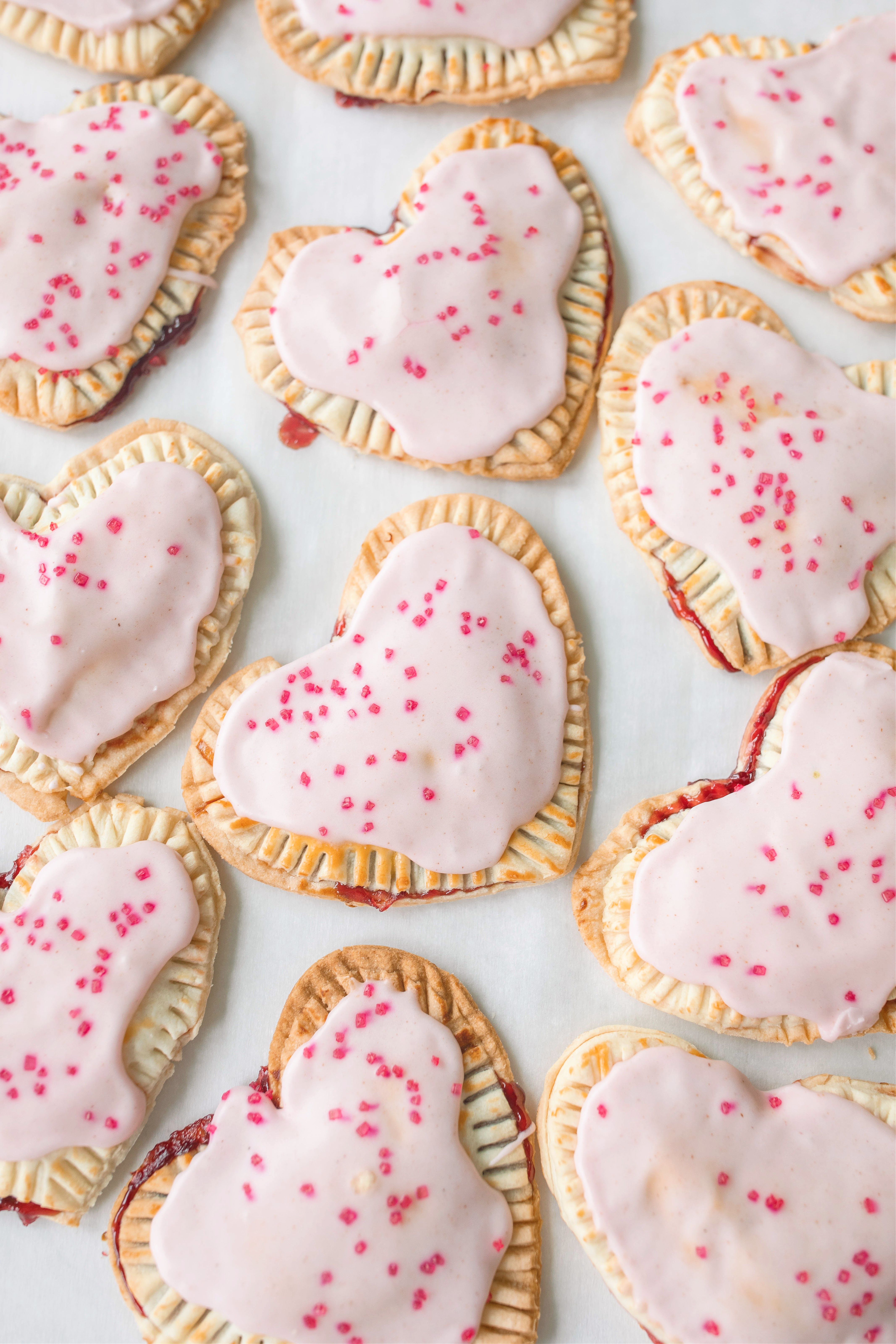 heart poptarts, cherry poptarts, brown sugar poptarts, cute poptart dessert, easy diy poptarts, valentines day, pastries, cherry almond poptarts, cute gift ideas, bakery box, recipe, easy dessert, frosted poptarts