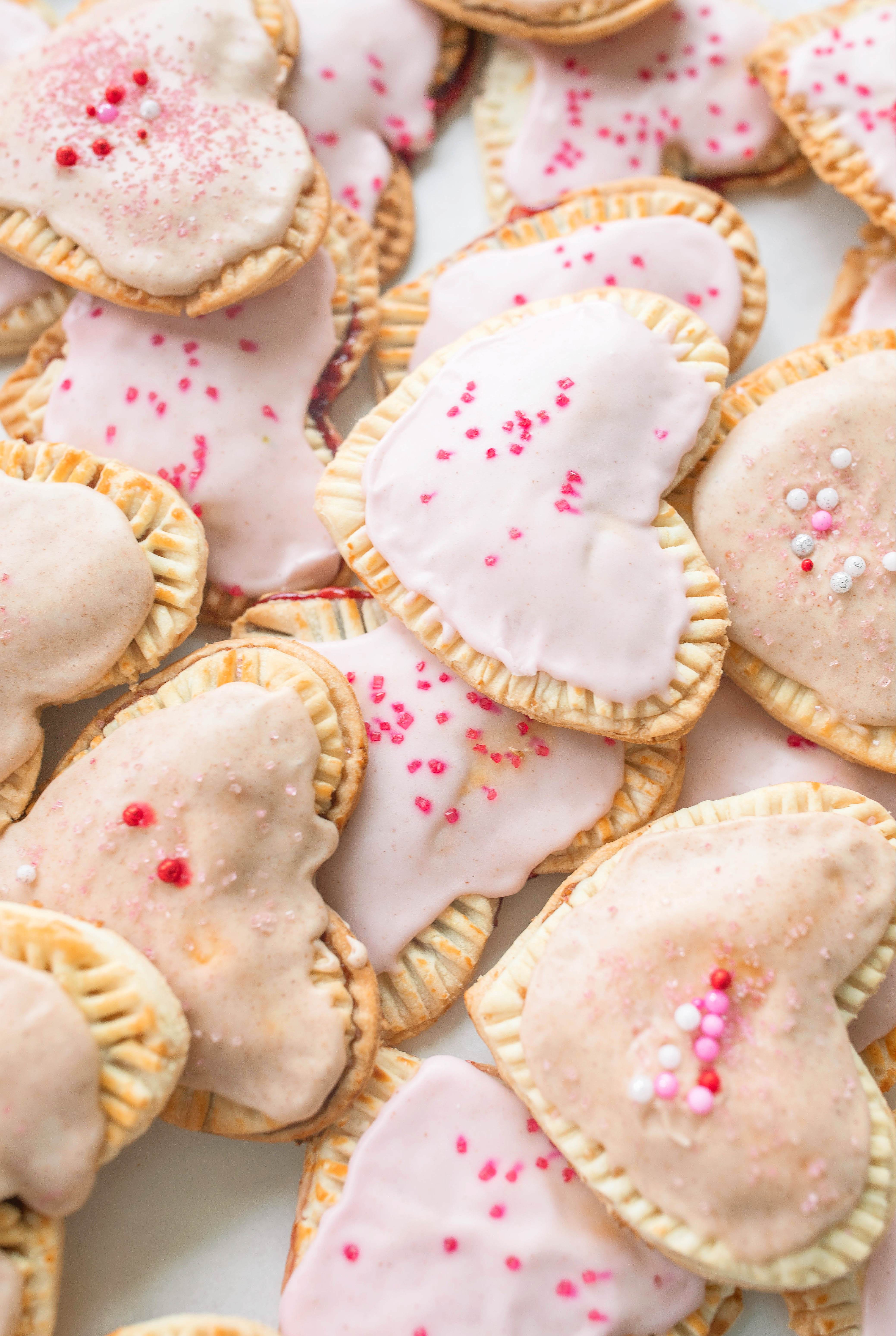 heart poptarts, cherry poptarts, brown sugar poptarts, cute poptart dessert, easy diy poptarts, valentines day, pastries, cherry almond poptarts, cute gift ideas, bakery box, recipe, easy dessert, frosted poptarts