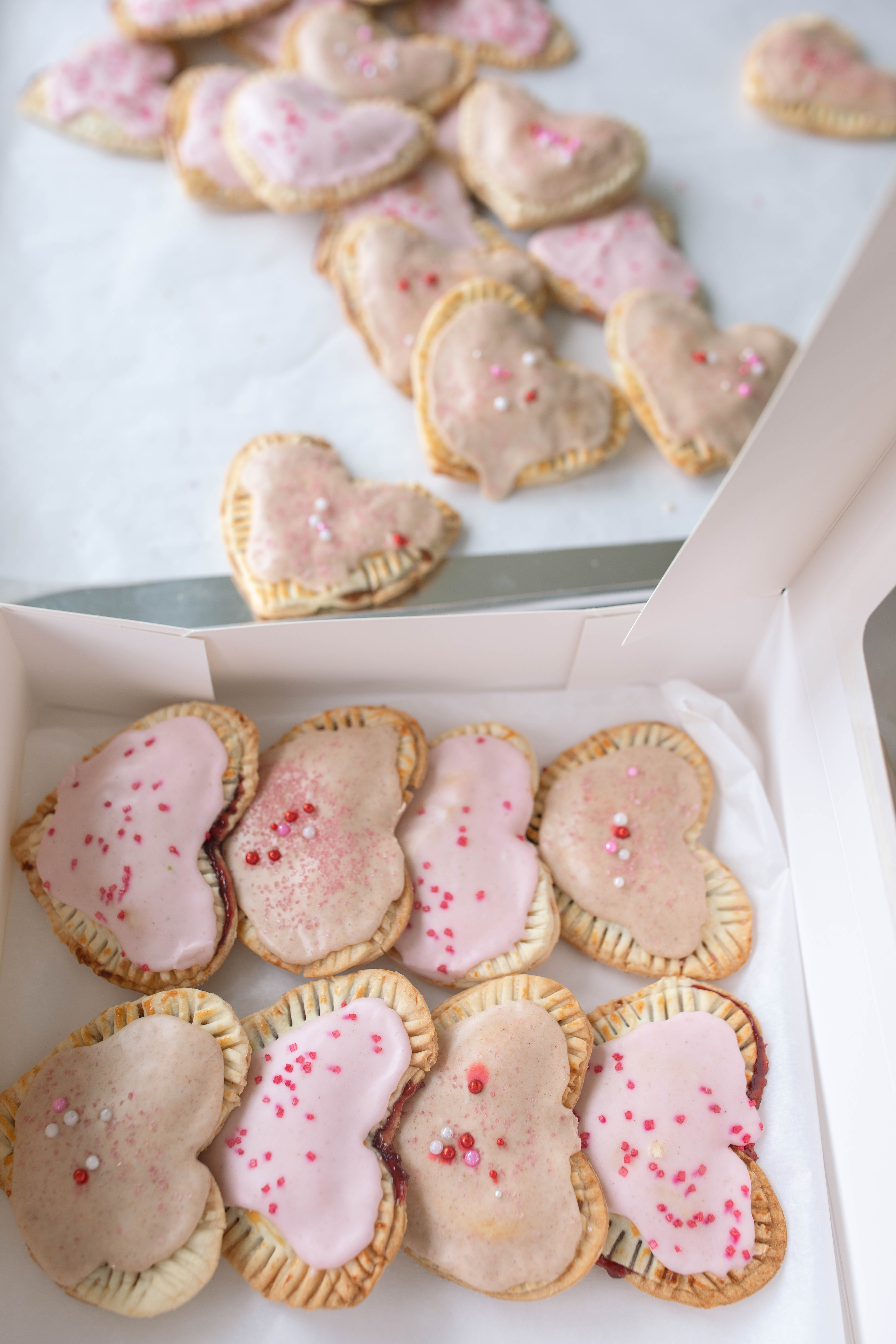 heart poptarts, cherry poptarts, brown sugar poptarts, cute poptart dessert, easy diy poptarts, valentines day, pastries, cherry almond poptarts, cute gift ideas, bakery box, recipe, easy dessert, frosted poptarts