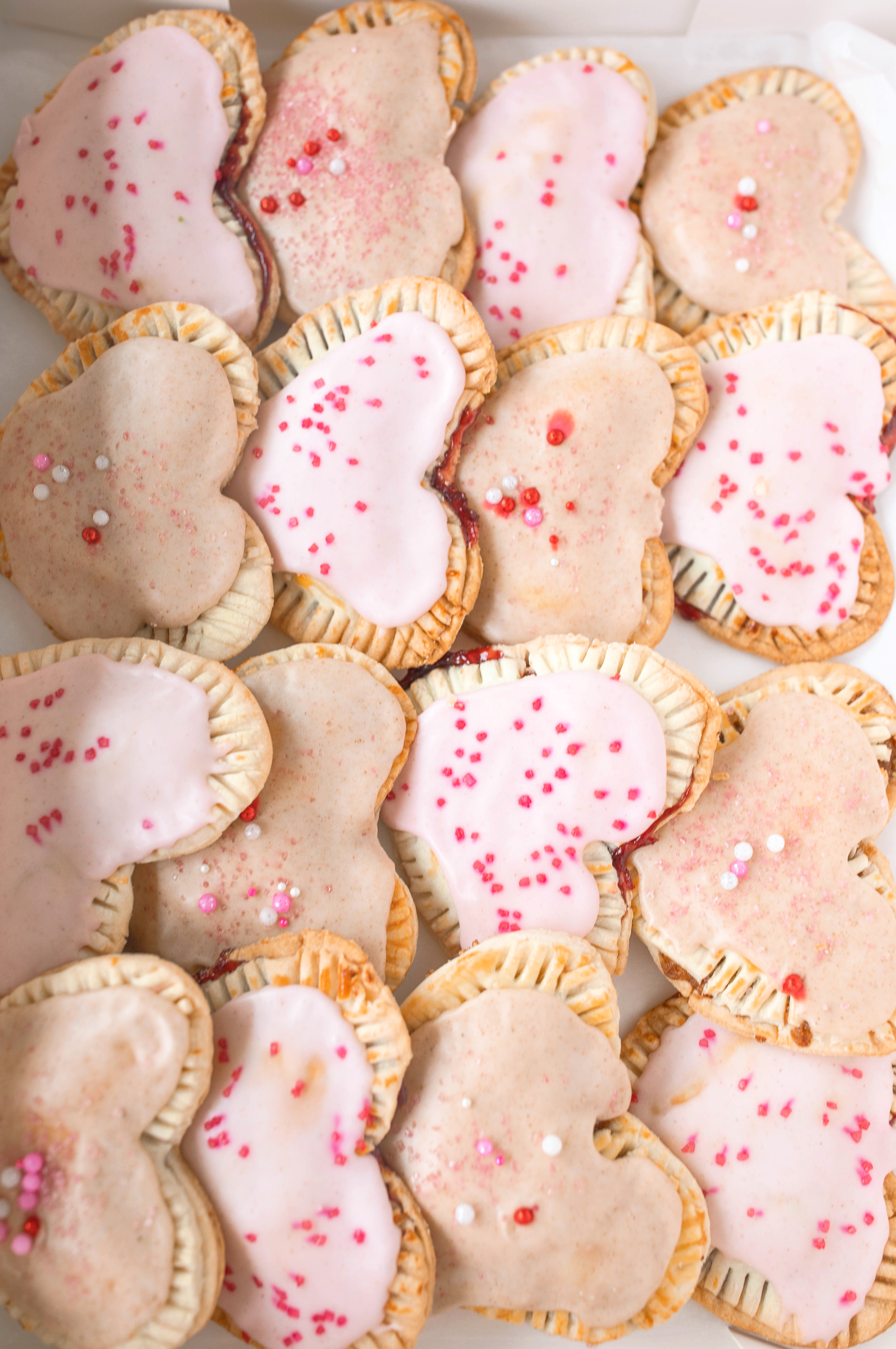 heart poptarts, cherry poptarts, brown sugar poptarts, cute poptart dessert, easy diy poptarts, valentines day, pastries, cherry almond poptarts, cute gift ideas, bakery box, recipe, easy dessert, frosted poptarts