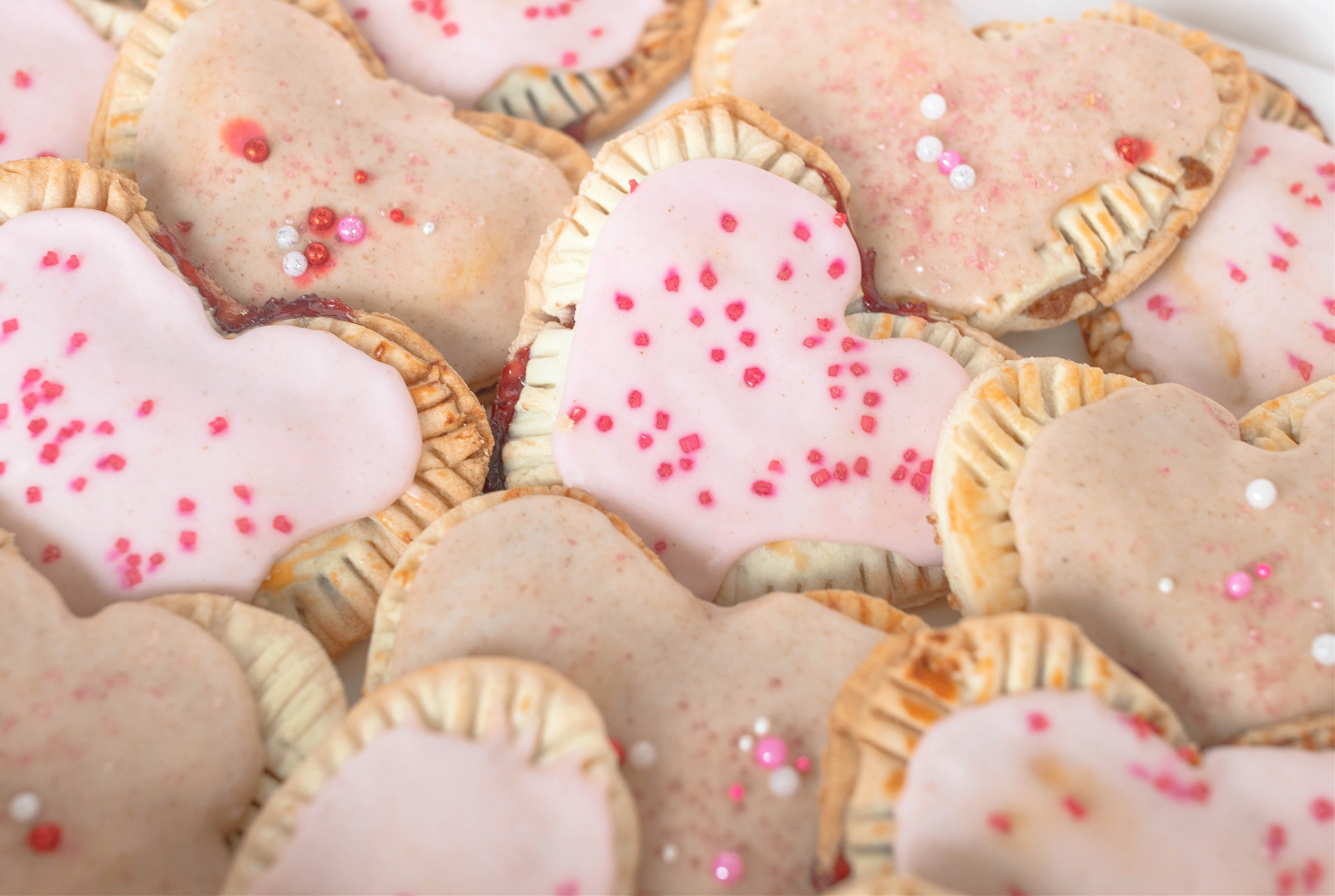 heart poptarts, cherry poptarts, brown sugar poptarts, cute poptart dessert, easy diy poptarts, valentines day, pastries, cherry almond poptarts, cute gift ideas, bakery box, recipe, easy dessert, frosted poptarts