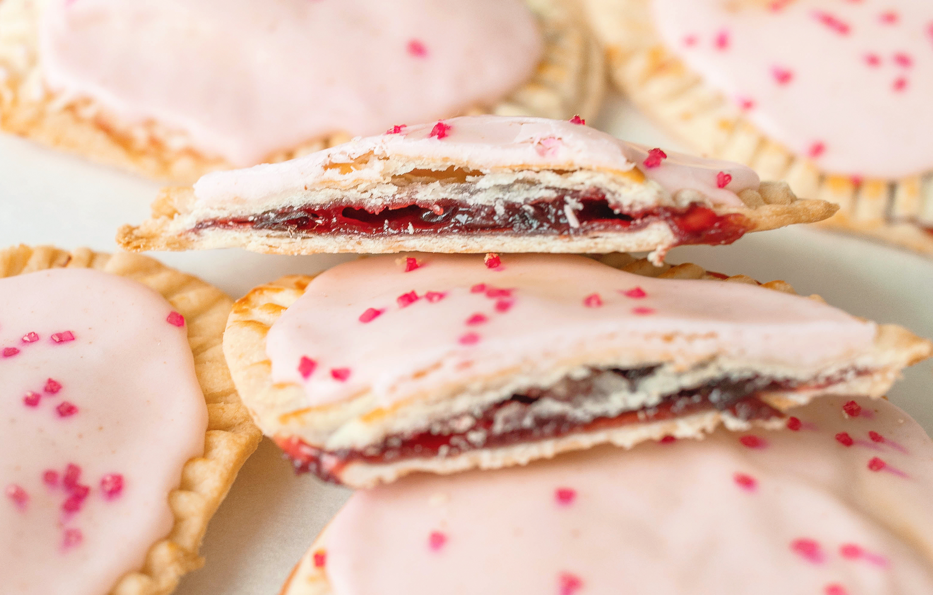 heart poptarts, cherry poptarts, brown sugar poptarts, cute poptart dessert, easy diy poptarts, valentines day, pastries, cherry almond poptarts, cute gift ideas, bakery box, recipe, easy dessert, frosted poptarts