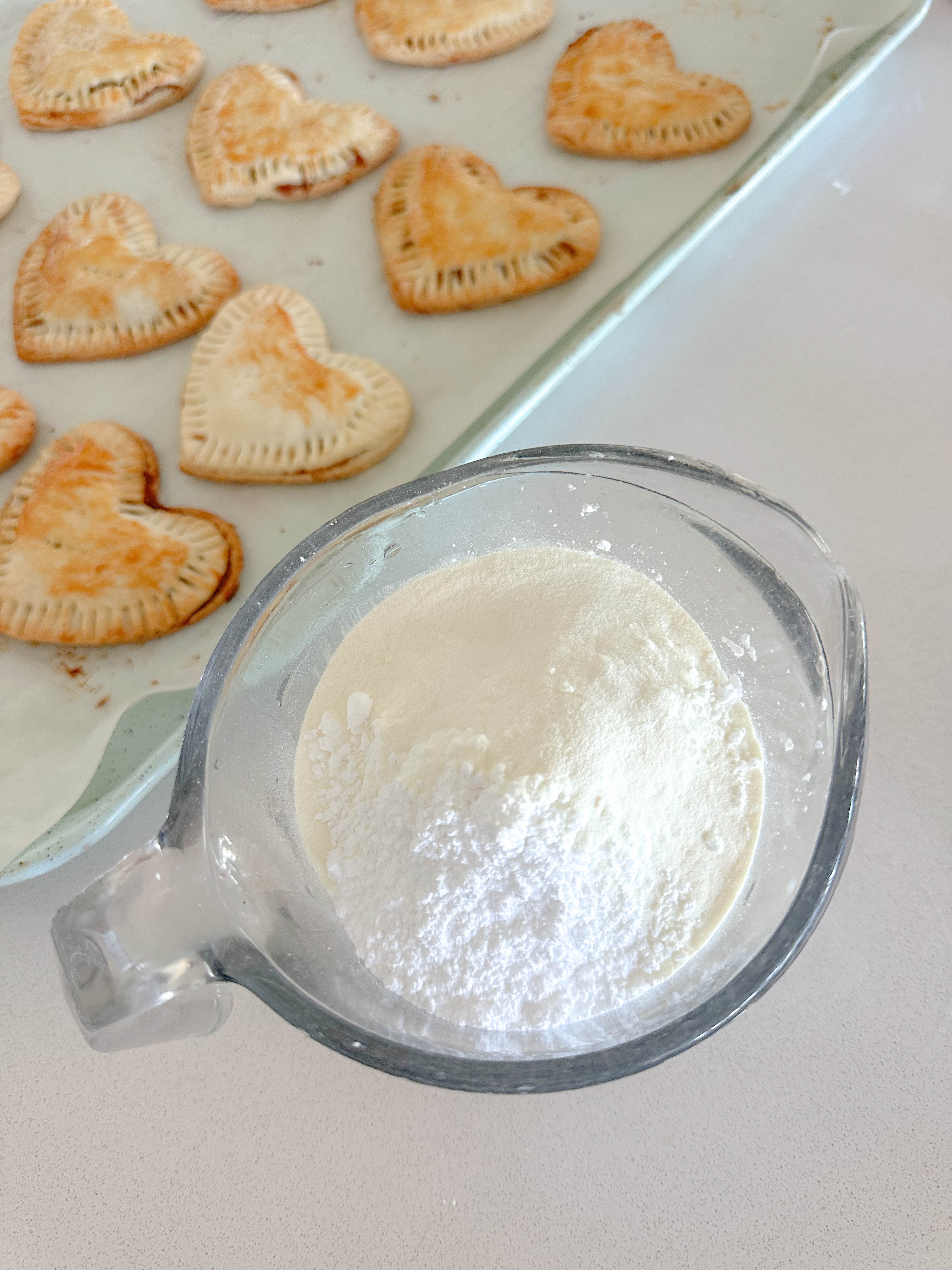 heart poptarts, cherry poptarts, brown sugar poptarts, cute poptart dessert, easy diy poptarts, valentines day, pastries, cherry almond poptarts, cute gift ideas, bakery box, recipe, easy dessert, frosted poptarts