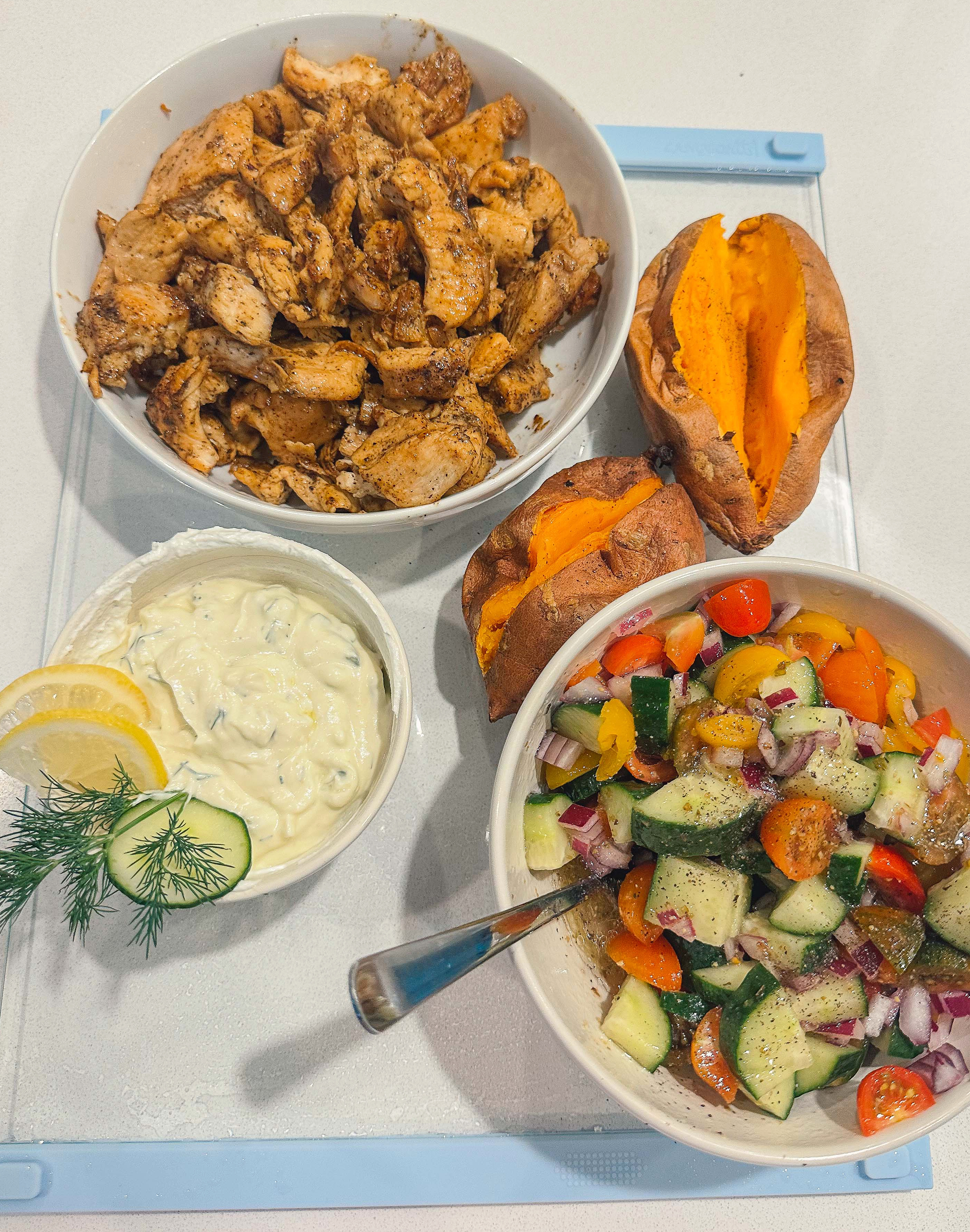 greek bowls, chicken, tzatziki, sweet potato, healthy dinner, gluten free, greek dressing, cucumbers, healthy dinner, easy 30 minute meal, meal prep, recipes, simply taralynn, greek bowls for dinner, dutch oven chicken, easy dinner idea, lemon, family dinner, food prep, nutrition, protein bowls