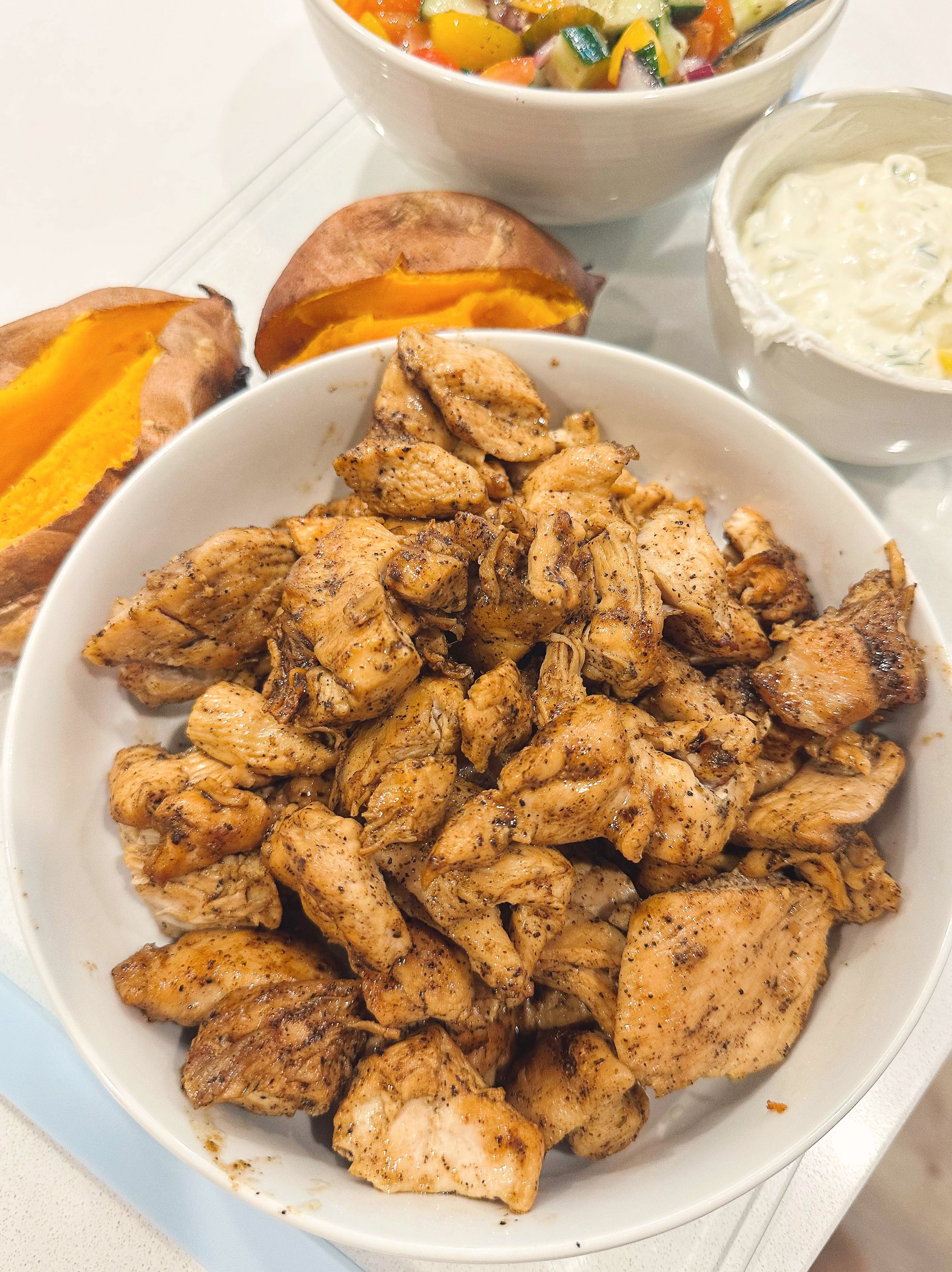 greek bowls, chicken, tzatziki, sweet potato, healthy dinner, gluten free, greek dressing, cucumbers, healthy dinner, easy 30 minute meal, meal prep, recipes, simply taralynn, greek bowls for dinner, dutch oven chicken, easy dinner idea, lemon, family dinner, food prep, nutrition, protein bowls