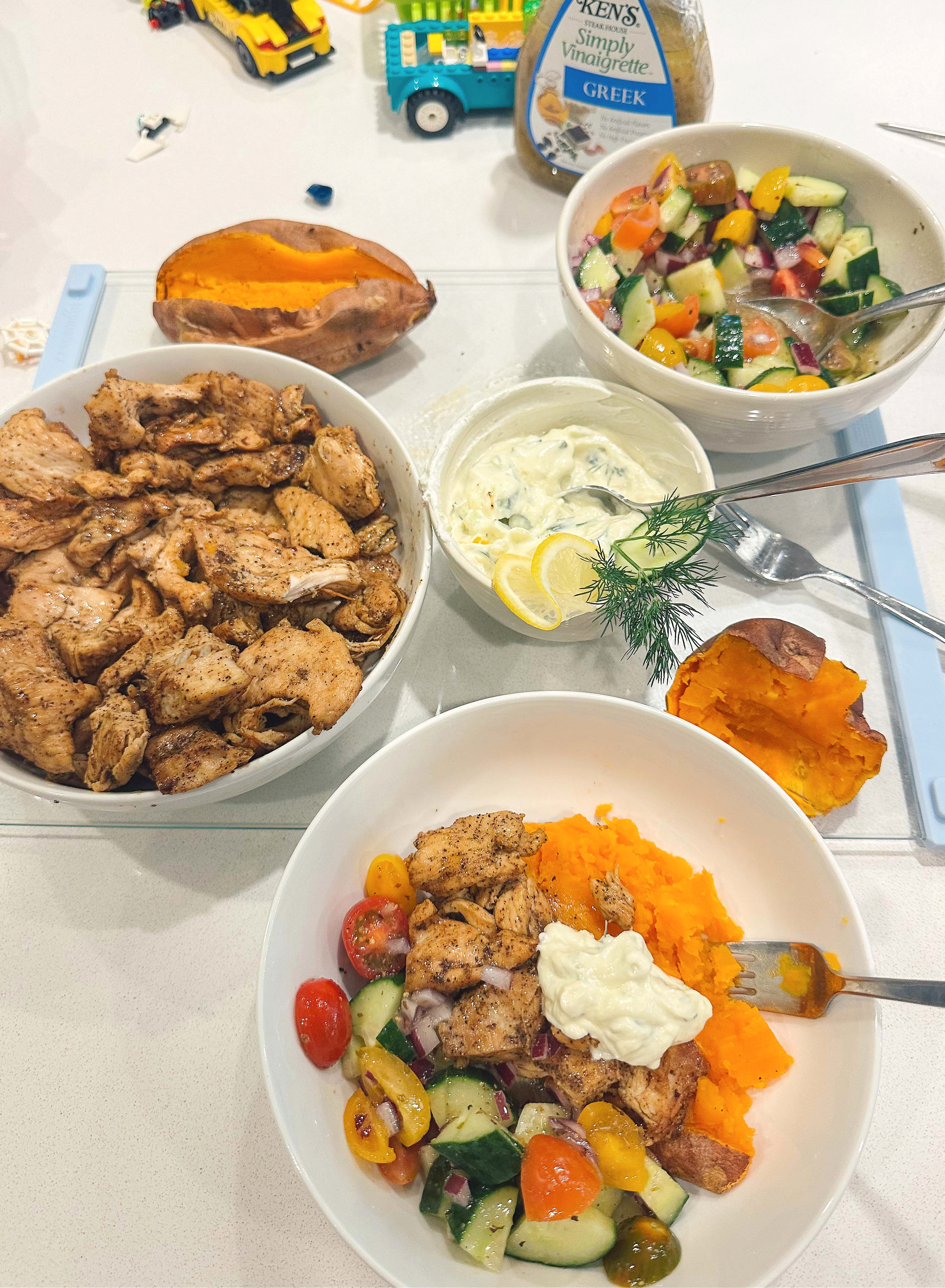 greek bowls, chicken, tzatziki, sweet potato, healthy dinner, gluten free, greek dressing, cucumbers, healthy dinner, easy 30 minute meal, meal prep, recipes, simply taralynn, greek bowls for dinner, dutch oven chicken, easy dinner idea, lemon, family dinner, food prep, nutrition, protein bowls
