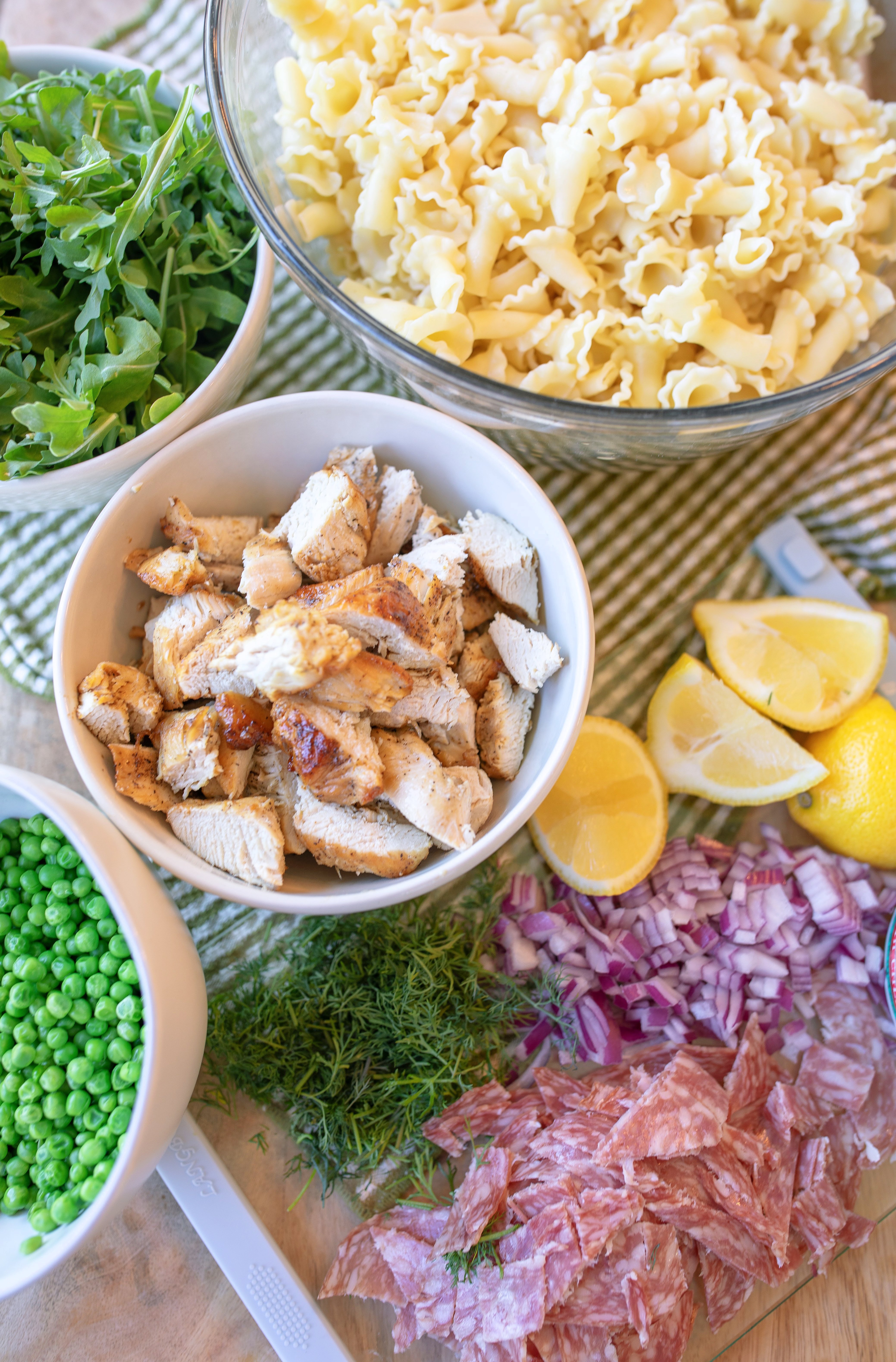 pasta salad, arugula, trader joes, salami, cold pasta salad recipe, ricotta, lemon ricotta pasta salad, pepper, sea salt, garlic, grilled chicken, healthy recipes, spring recipes, potluck, easy to make, lemon pasta, garlic, arugula salad, pasta salad for summer, summer recipes, beautiful pasta