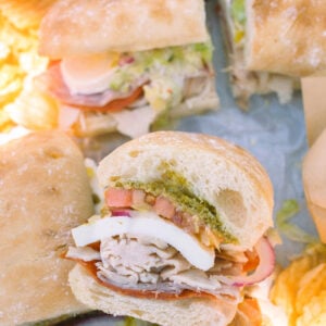 Italian subs, Italian sub recipe, homemade Italian subs, pool day sandwiches, summer sandwich recipes, easy Italian sandwich, toasted Italian subs, deli style subs, Italian hoagie recipe, summer lunch ideas, crowd pleasing sandwiches, family lunch recipes, sandwich recipes for a crowd, mozzarella Italian sandwich, pesto Italian subs, homemade Italian dressing, picnic sandwich ideas, beach sandwiches, pool party food ideas, easy summer meals, Italian grinder sandwich, grinder sandwich recipe, layered Italian sandwich, cold sandwich recipes, hot Italian sandwich, salami sandwich recipe, turkey and salami sandwich, fresh mozzarella sandwich, banana pepper sandwich, bakery bread sandwiches, easy entertaining recipes, lunch sandwich ideas, make ahead sandwiches, summer entertaining food, Italian deli sandwich, crispy lettuce sandwich, oven baked subs, easy pool day food, family friendly sandwiches