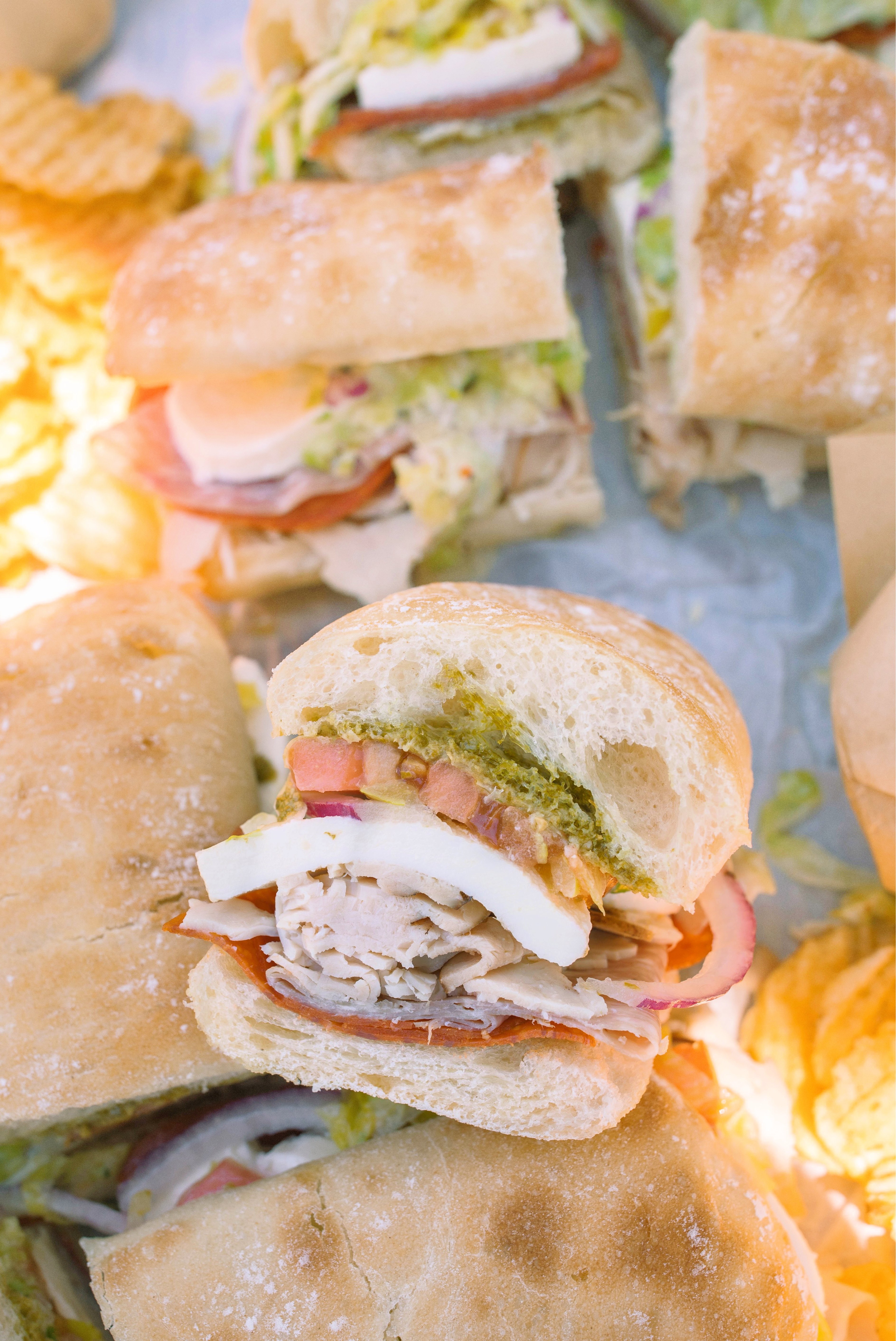 Italian subs, Italian sub recipe, homemade Italian subs, pool day sandwiches, summer sandwich recipes, easy Italian sandwich, toasted Italian subs, deli style subs, Italian hoagie recipe, summer lunch ideas, crowd pleasing sandwiches, family lunch recipes, sandwich recipes for a crowd, mozzarella Italian sandwich, pesto Italian subs, homemade Italian dressing, picnic sandwich ideas, beach sandwiches, pool party food ideas, easy summer meals, Italian grinder sandwich, grinder sandwich recipe, layered Italian sandwich, cold sandwich recipes, hot Italian sandwich, salami sandwich recipe, turkey and salami sandwich, fresh mozzarella sandwich, banana pepper sandwich, bakery bread sandwiches, easy entertaining recipes, lunch sandwich ideas, make ahead sandwiches, summer entertaining food, Italian deli sandwich, crispy lettuce sandwich, oven baked subs, easy pool day food, family friendly sandwiches