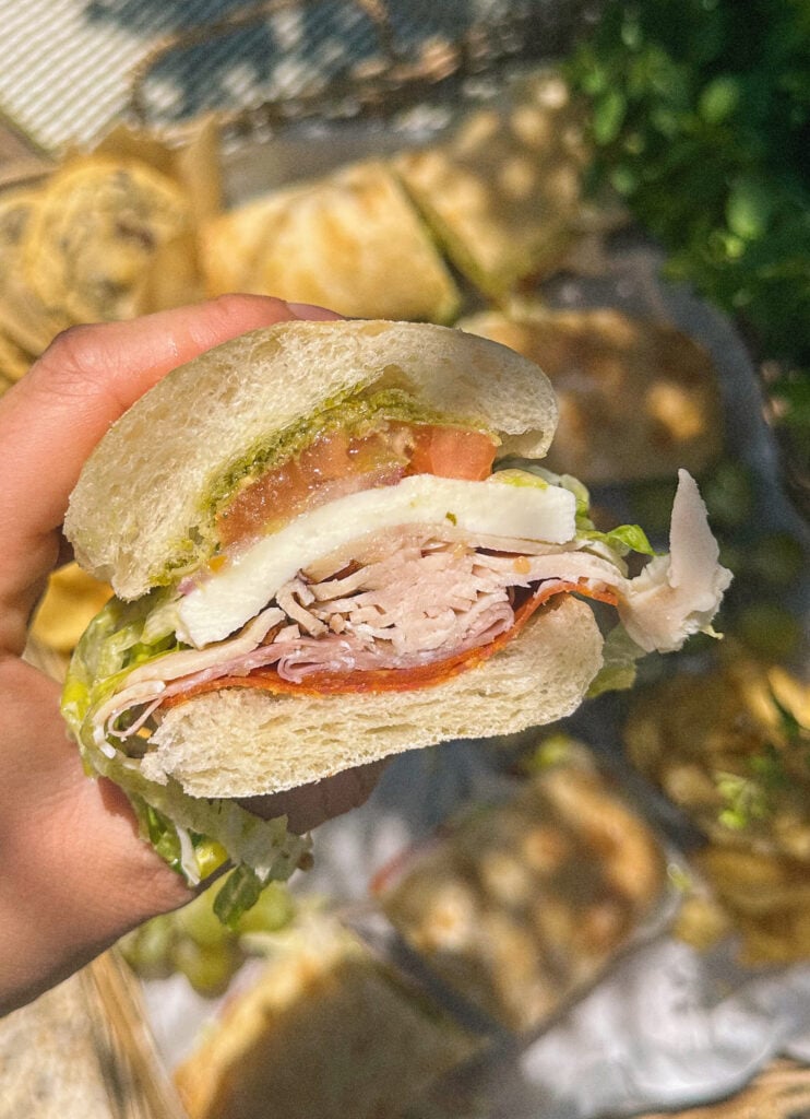 Italian subs, Italian sub recipe, homemade Italian subs, pool day sandwiches, summer sandwich recipes, easy Italian sandwich, toasted Italian subs, deli style subs, Italian hoagie recipe, summer lunch ideas, crowd pleasing sandwiches, family lunch recipes, sandwich recipes for a crowd, mozzarella Italian sandwich, pesto Italian subs, homemade Italian dressing, picnic sandwich ideas, beach sandwiches, pool party food ideas, easy summer meals, Italian grinder sandwich, grinder sandwich recipe, layered Italian sandwich, cold sandwich recipes, hot Italian sandwich, salami sandwich recipe, turkey and salami sandwich, fresh mozzarella sandwich, banana pepper sandwich, bakery bread sandwiches, easy entertaining recipes, lunch sandwich ideas, make ahead sandwiches, summer entertaining food, Italian deli sandwich, crispy lettuce sandwich, oven baked subs, easy pool day food, family friendly sandwiches