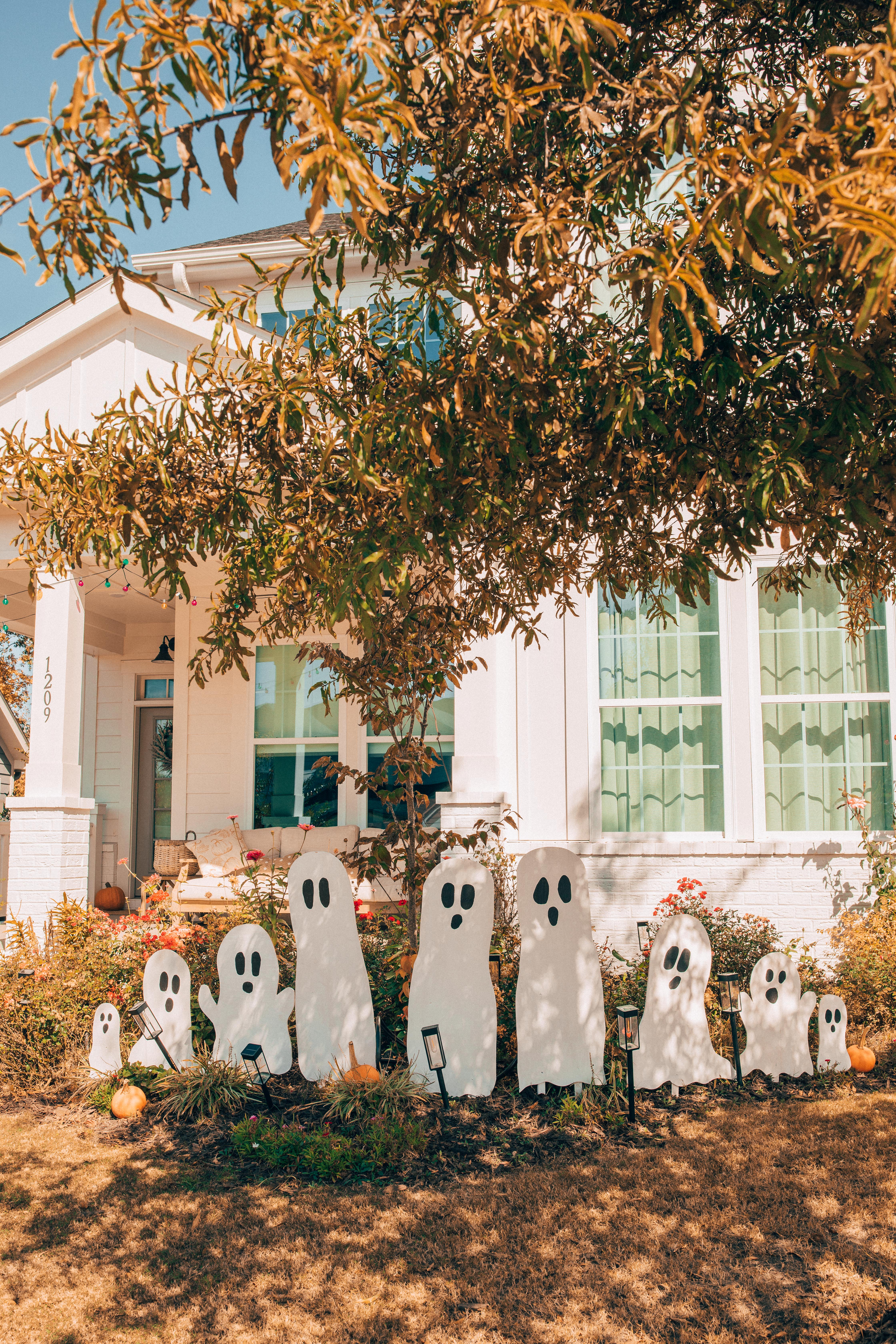 DIY wood cut out yard ghosts