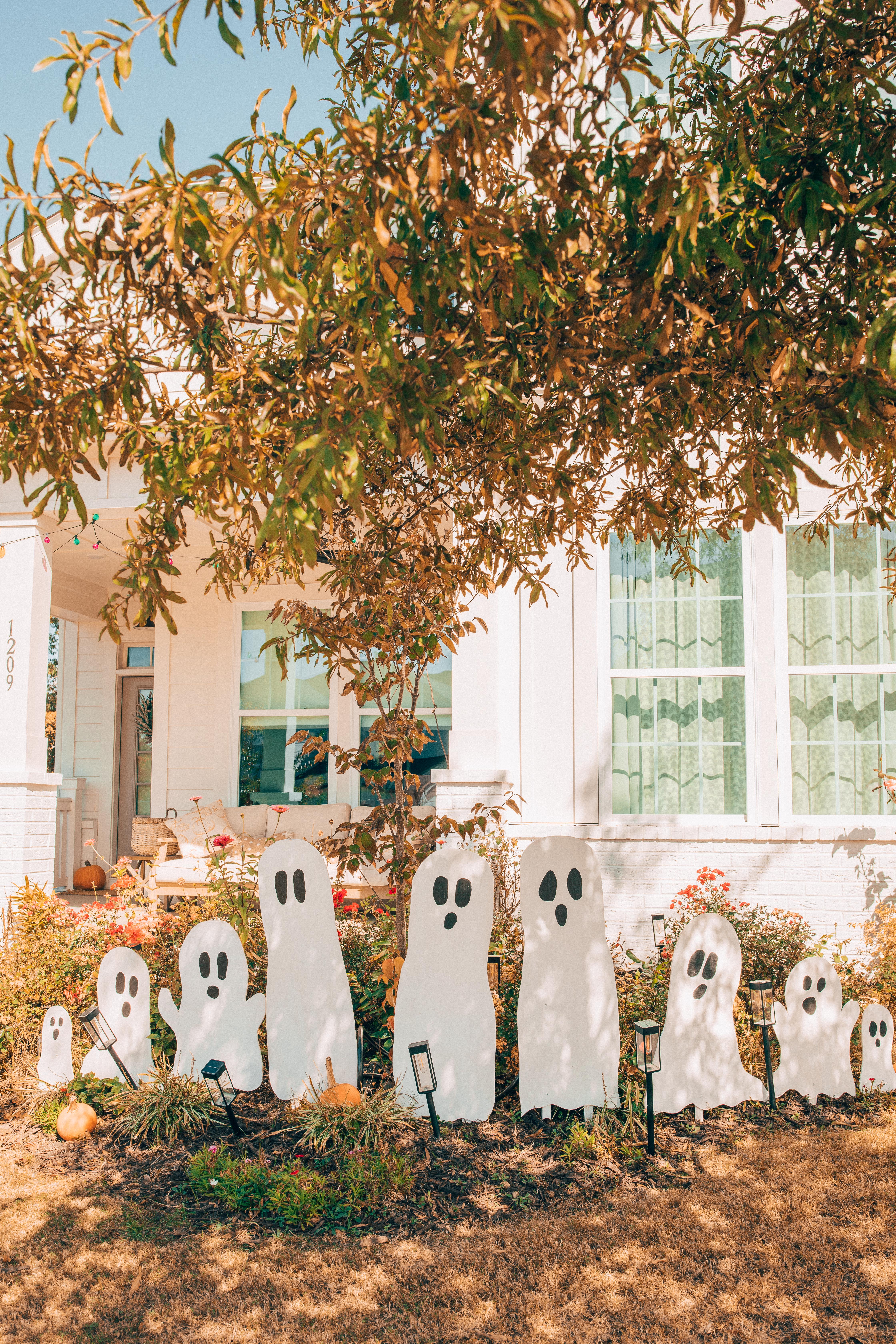 DIY wood cut out yard ghosts