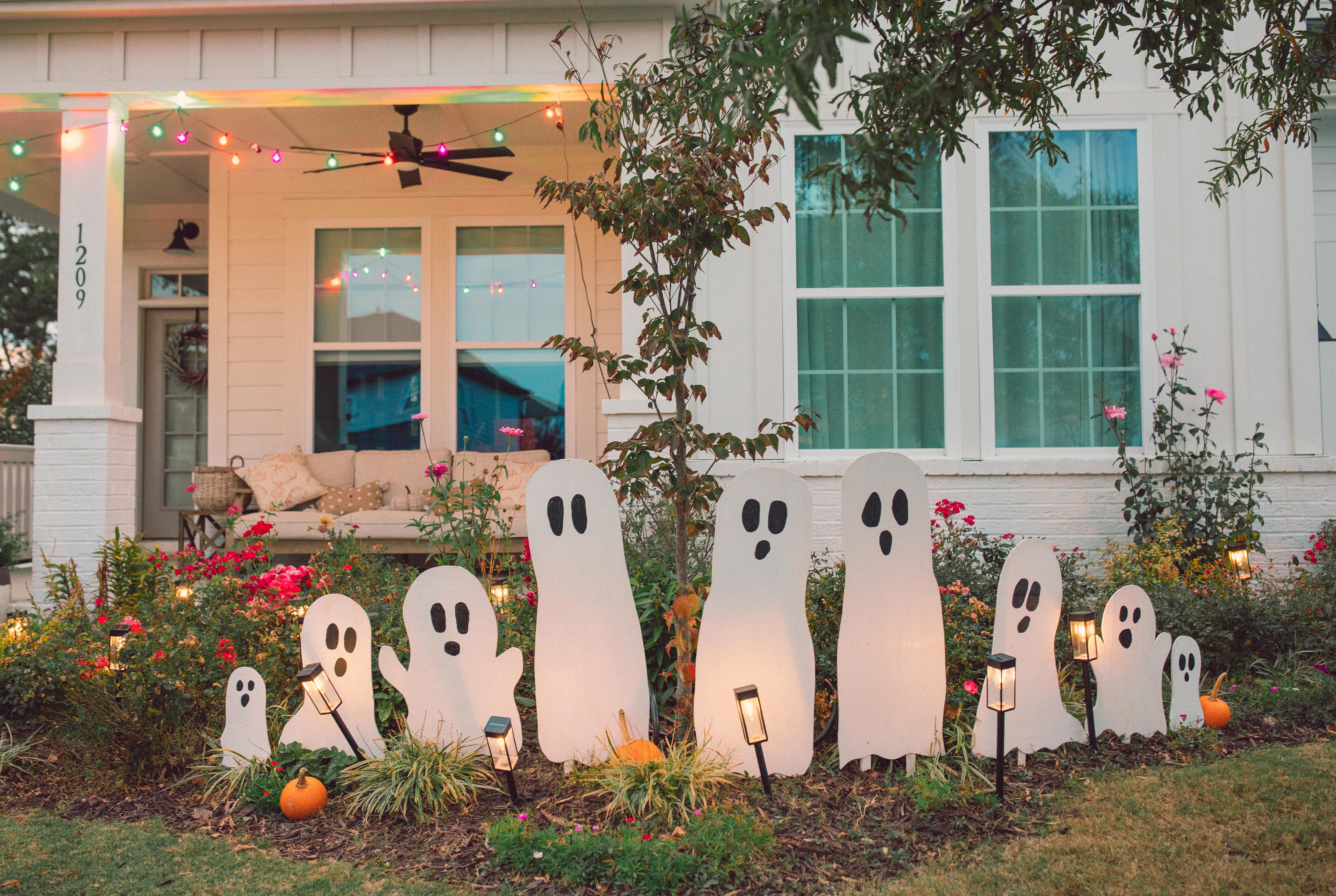 DIY wood cut out yard ghosts