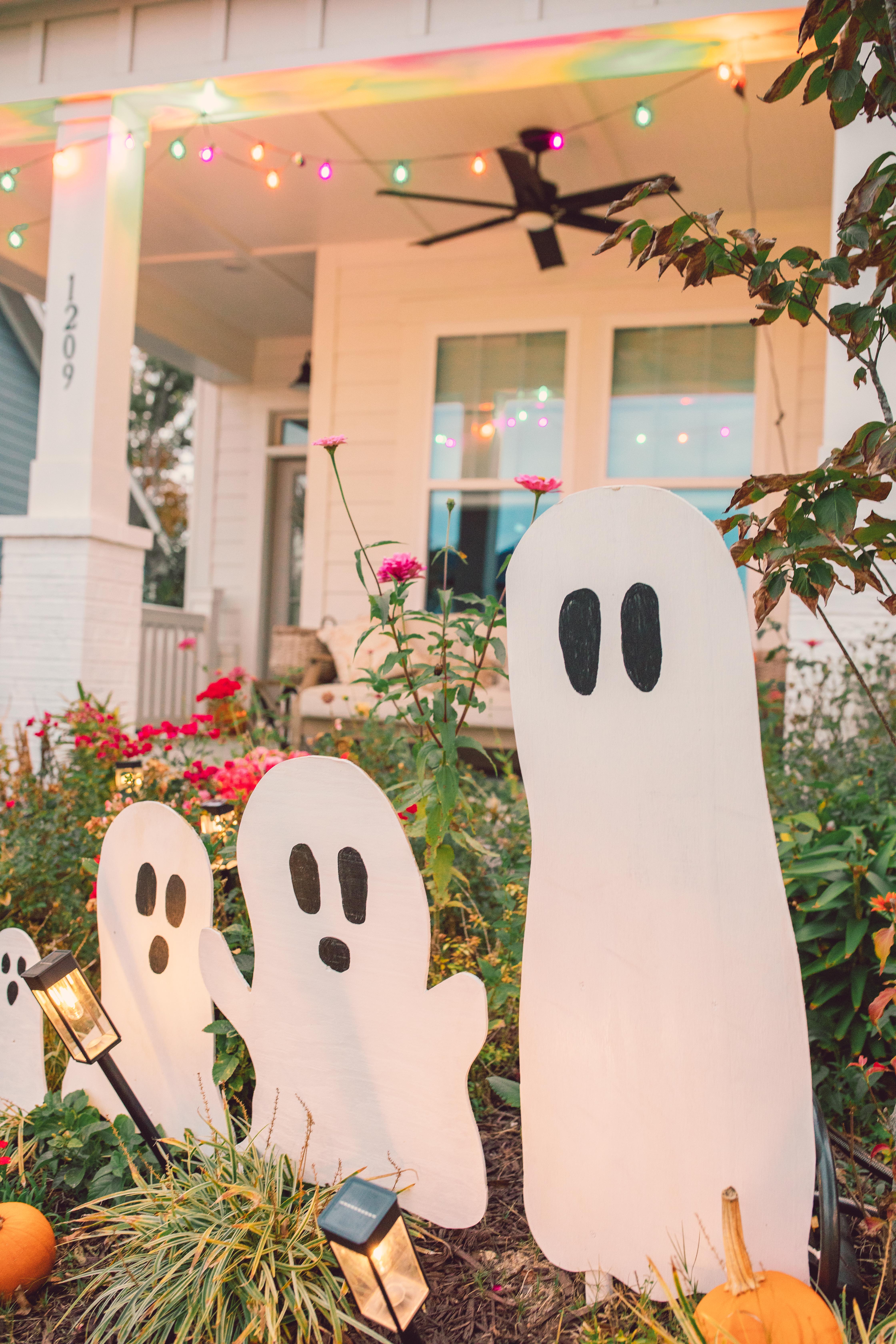 DIY wood cut out yard ghosts