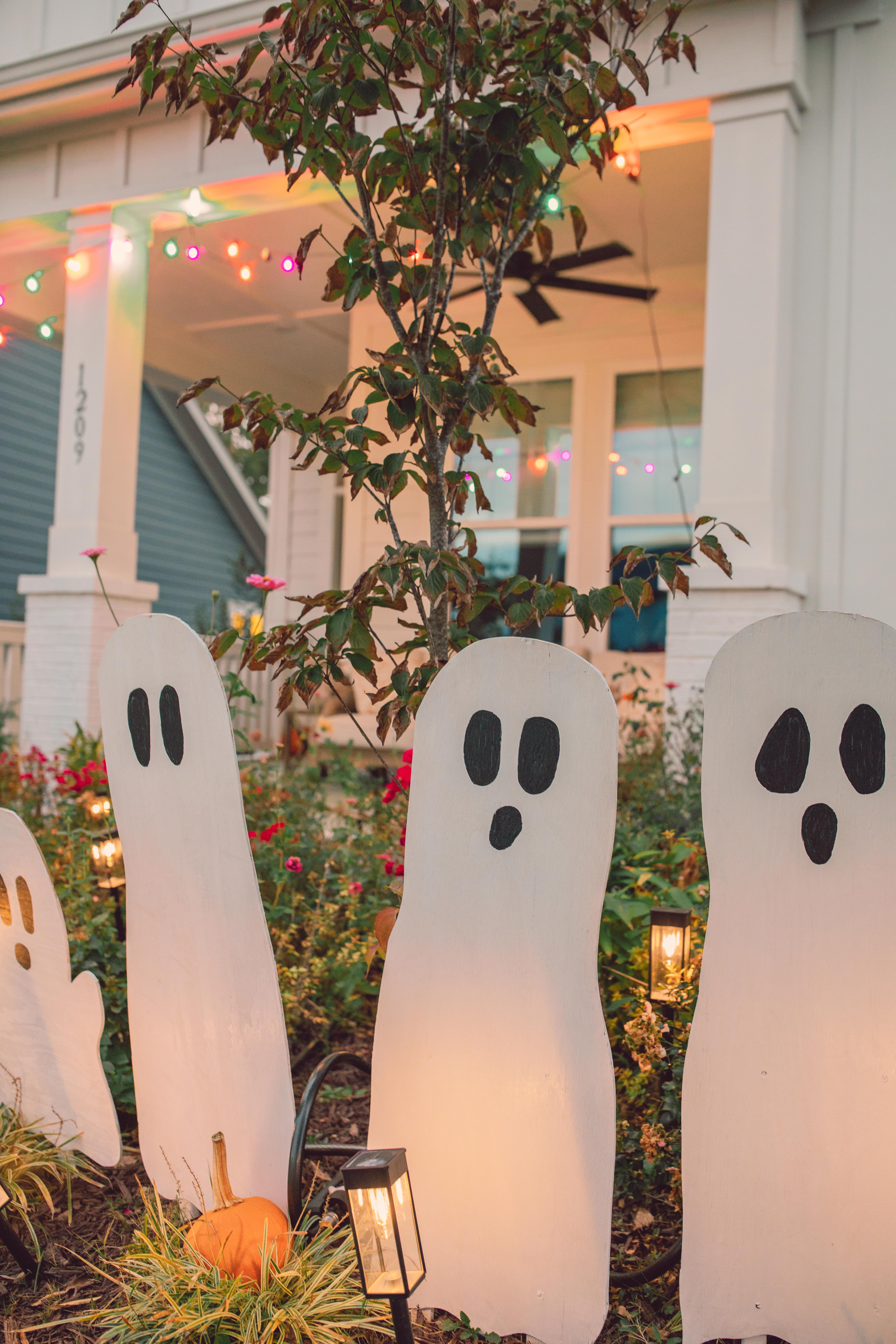 DIY wood cut out yard ghosts