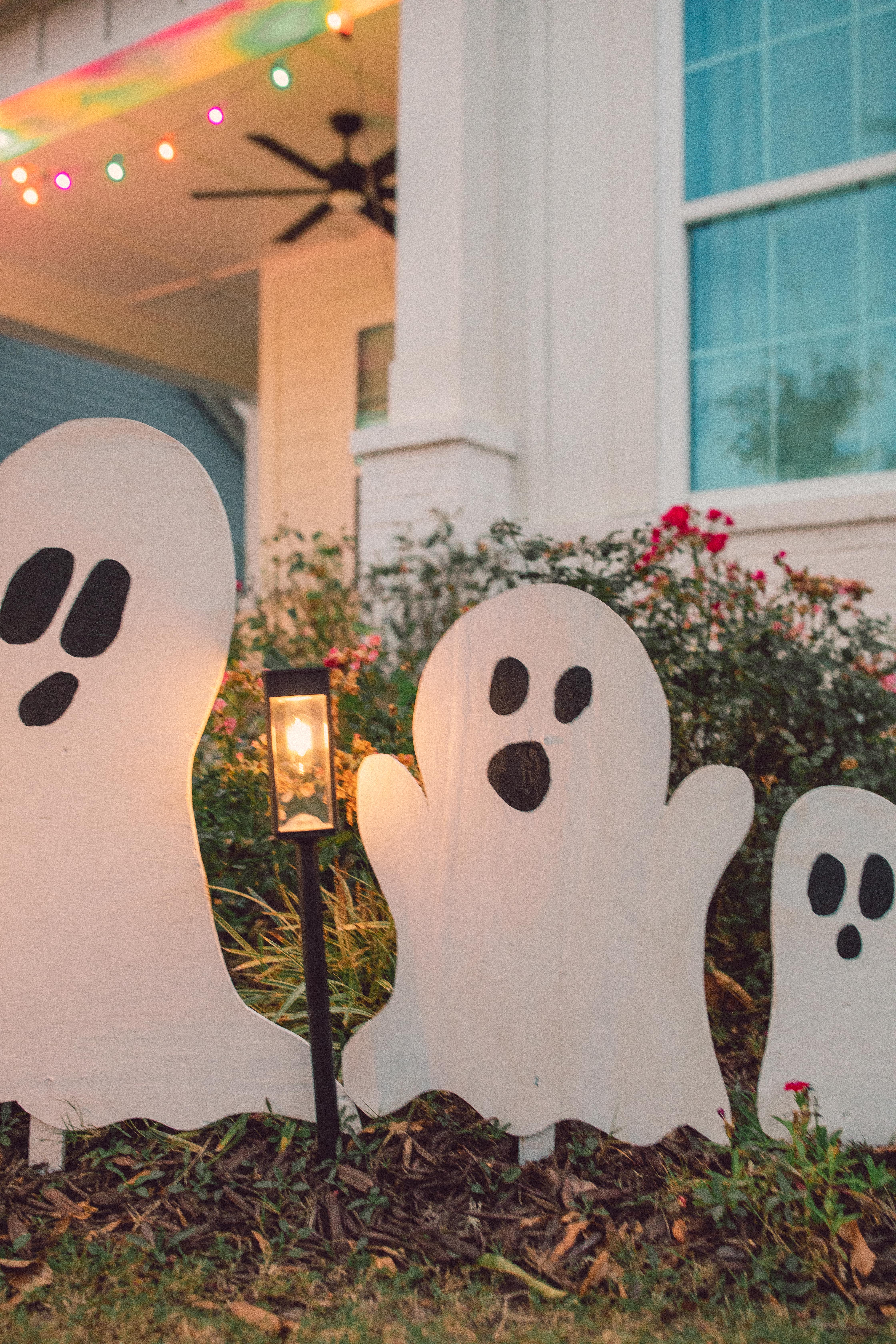 DIY wood cut out yard ghosts