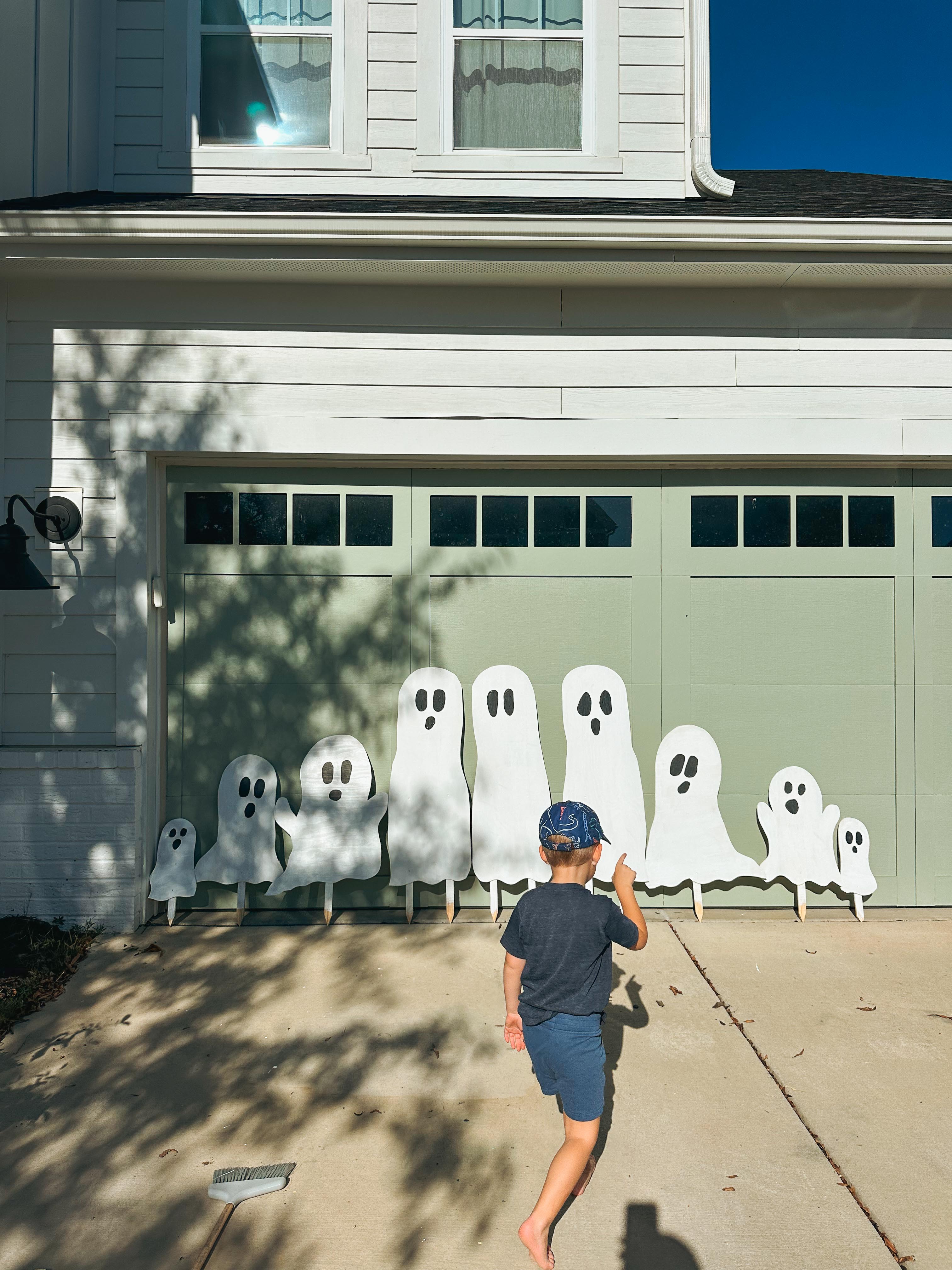 DIY wood cut out yard ghosts