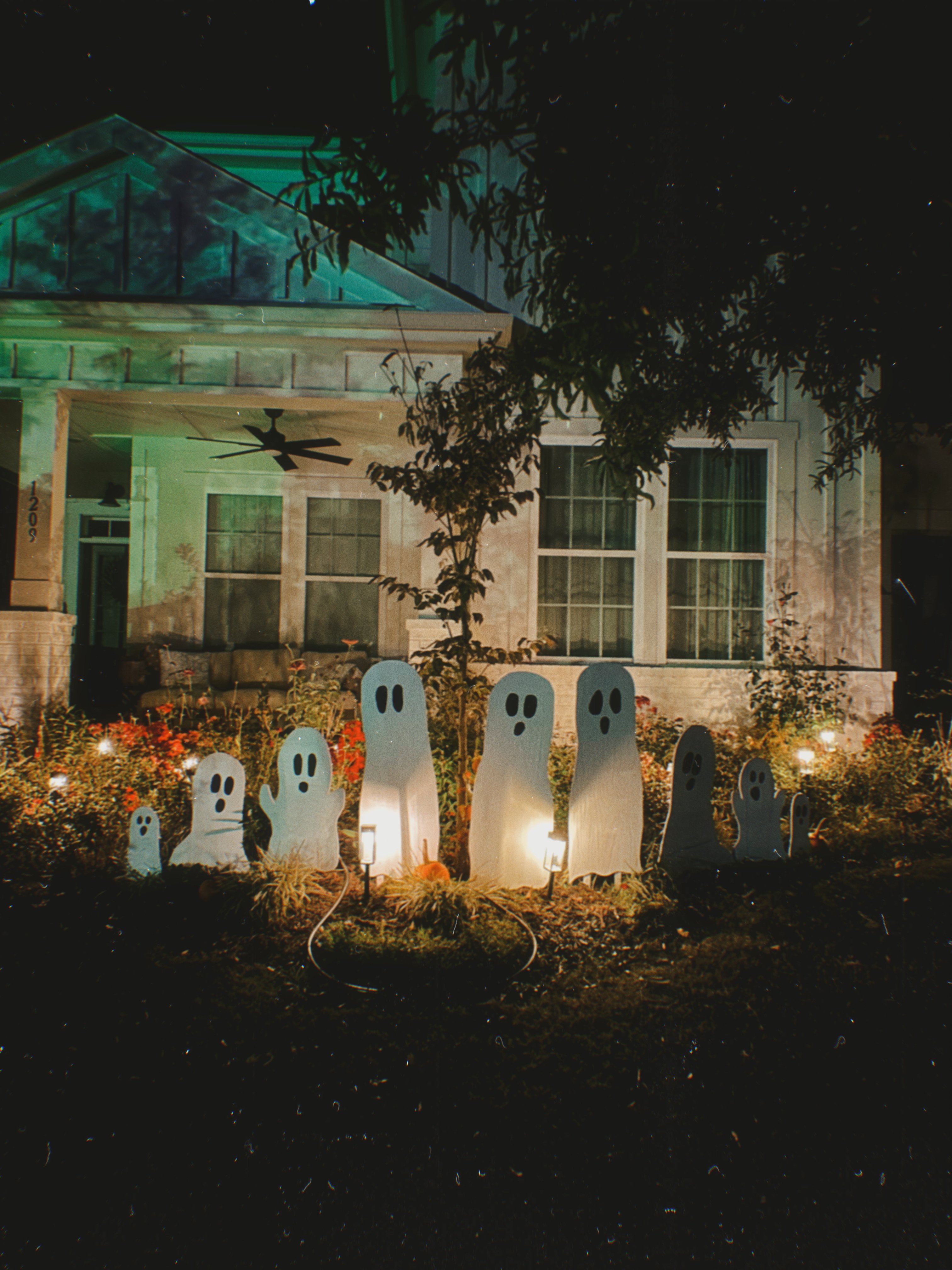 DIY wood cut out yard ghosts